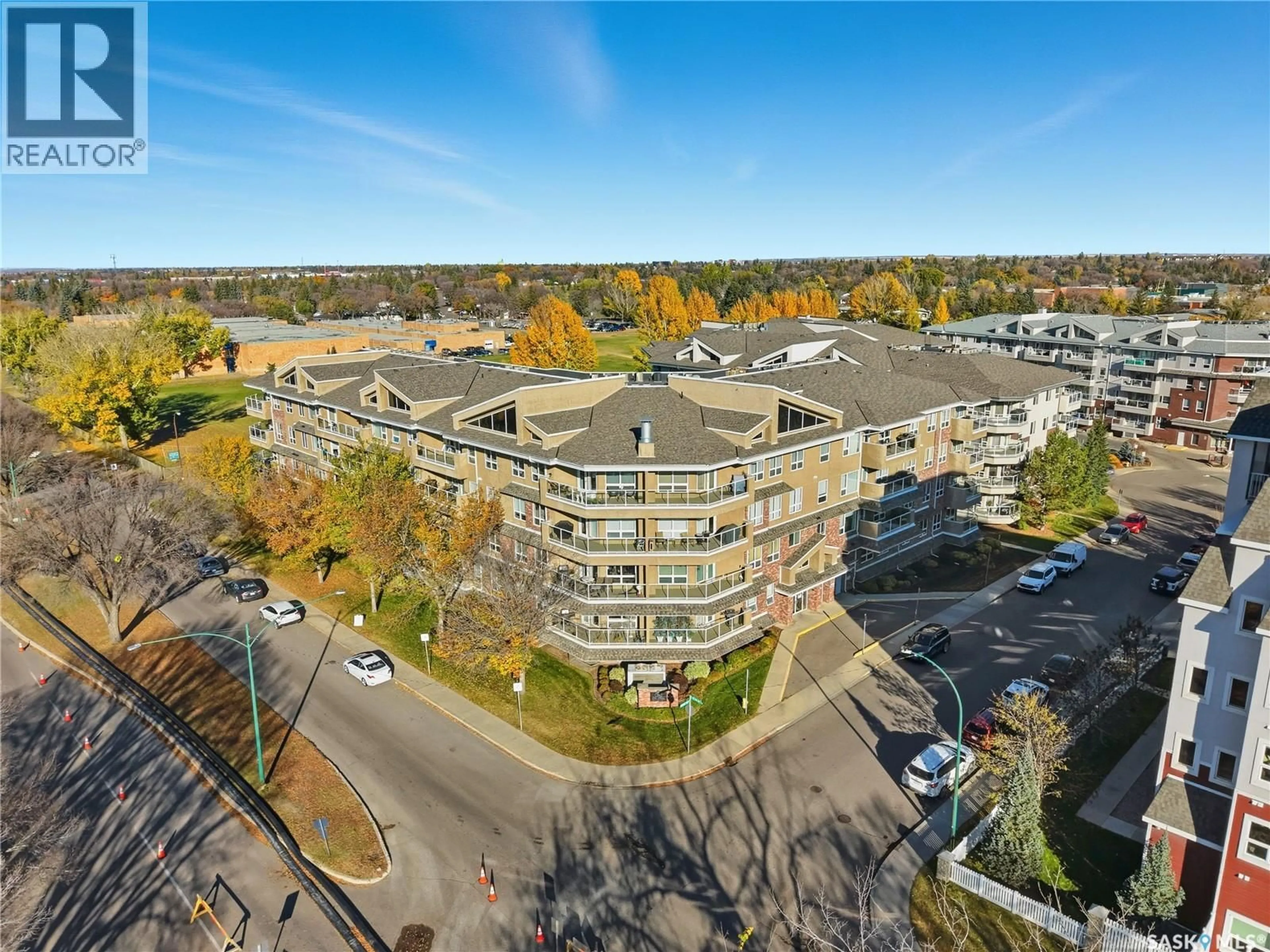 A pic from outside/outdoor area/front of a property/back of a property/a pic from drone, unknown for 204 - 102 ARMISTICE WAY, Saskatoon Saskatchewan S7J2Z6