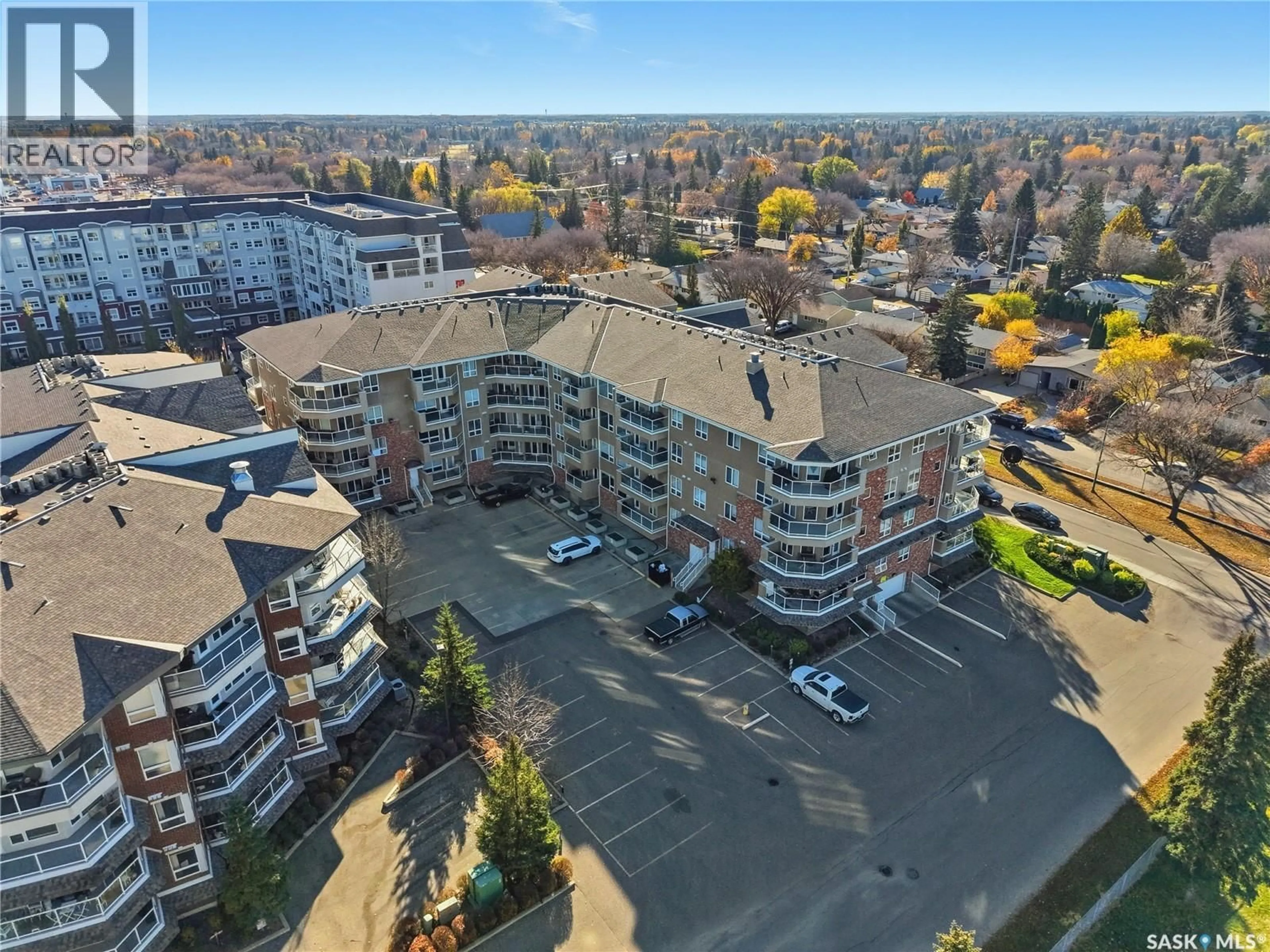 A pic from outside/outdoor area/front of a property/back of a property/a pic from drone, unknown for 204 - 102 ARMISTICE WAY, Saskatoon Saskatchewan S7J2Z6