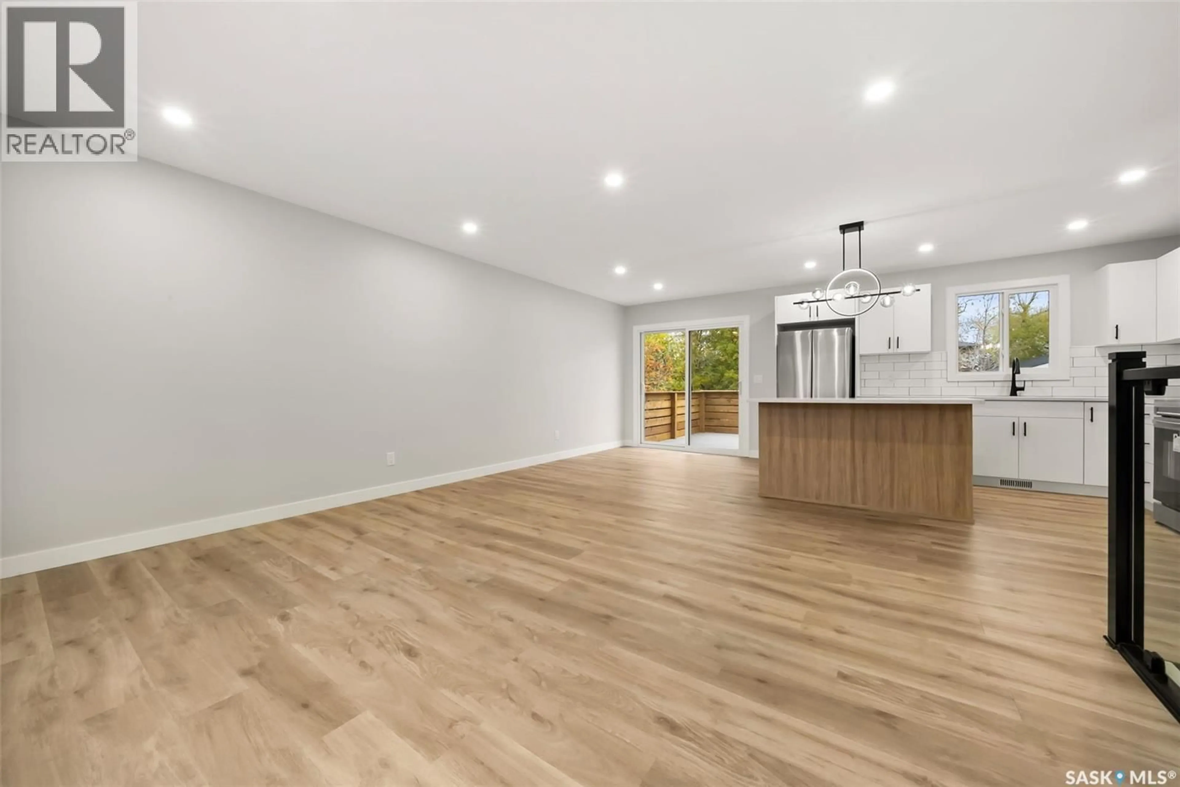 Open concept kitchen, wood/laminate floor for 116 MCCARTHY BOULEVARD, Regina Saskatchewan S4R6A6
