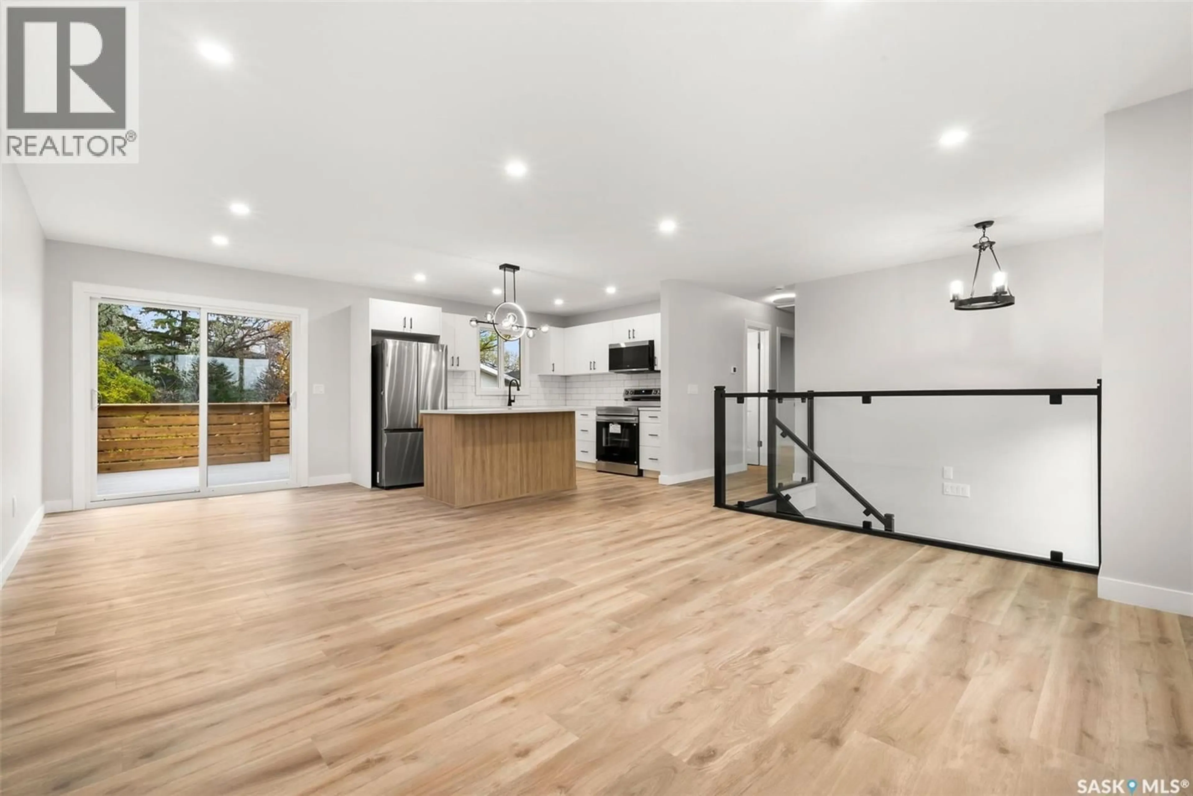 Open concept kitchen, wood/laminate floor for 116 MCCARTHY BOULEVARD, Regina Saskatchewan S4R6A6