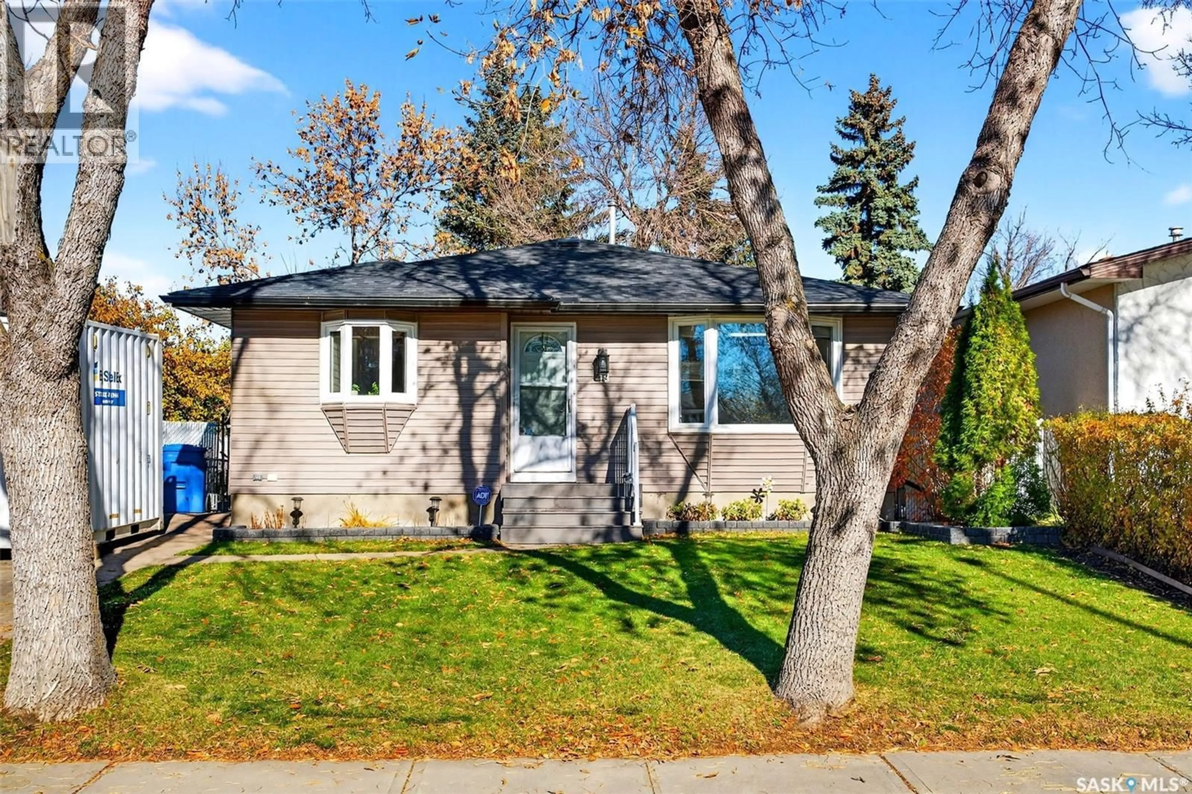 Home with vinyl exterior material, street for 18 MOLLOY ROAD, Regina Saskatchewan S4R6C4