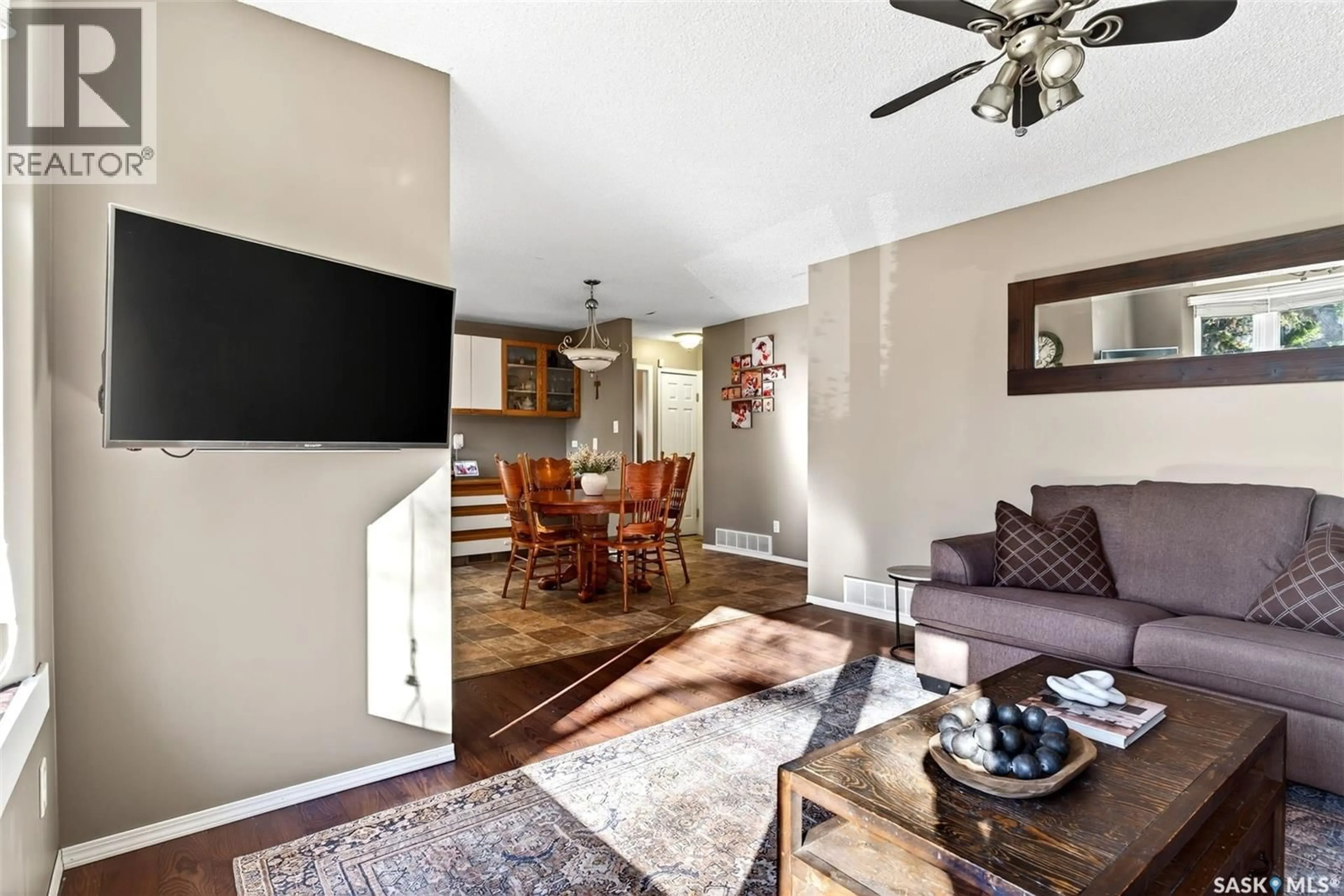 Living room with furniture, wood/laminate floor for 18 MOLLOY ROAD, Regina Saskatchewan S4R6C4