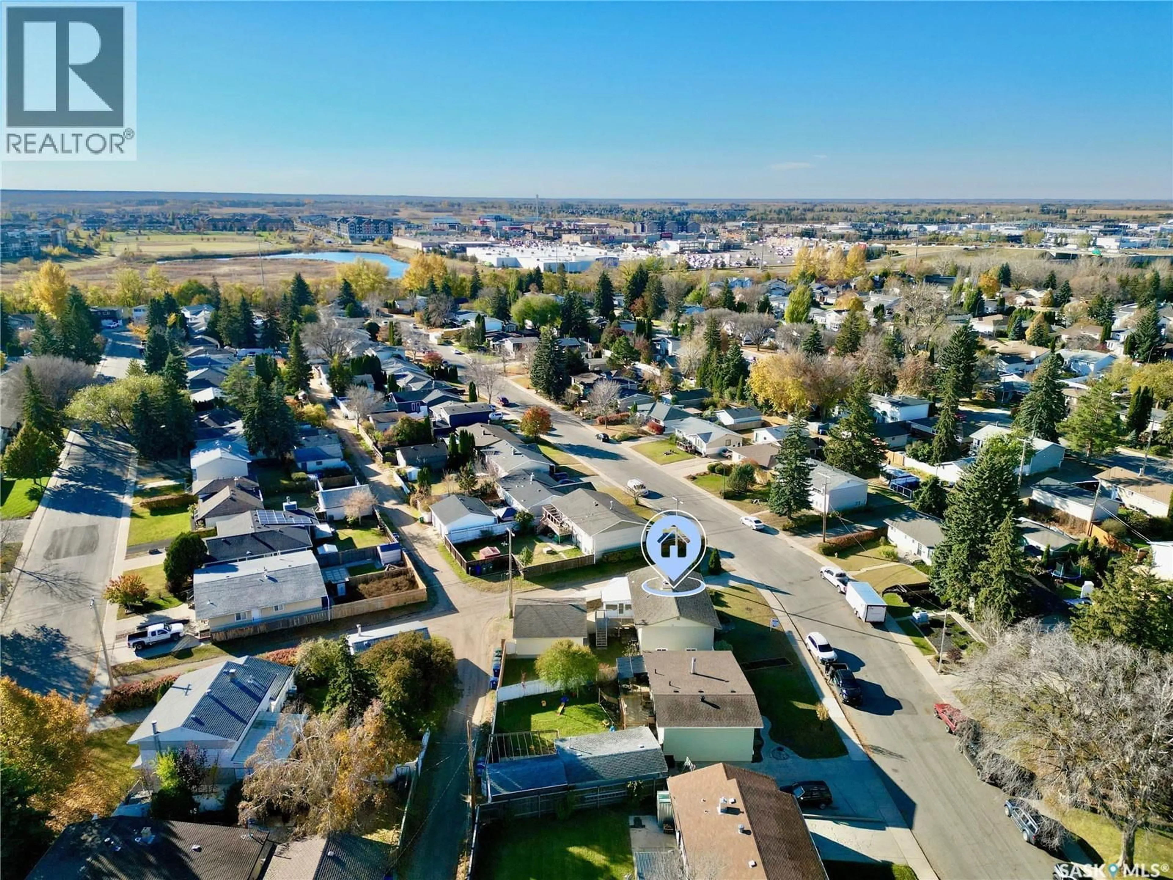 A pic from outside/outdoor area/front of a property/back of a property/a pic from drone, street for 144 MACLEAN CRESCENT, Saskatoon Saskatchewan S7J2R7