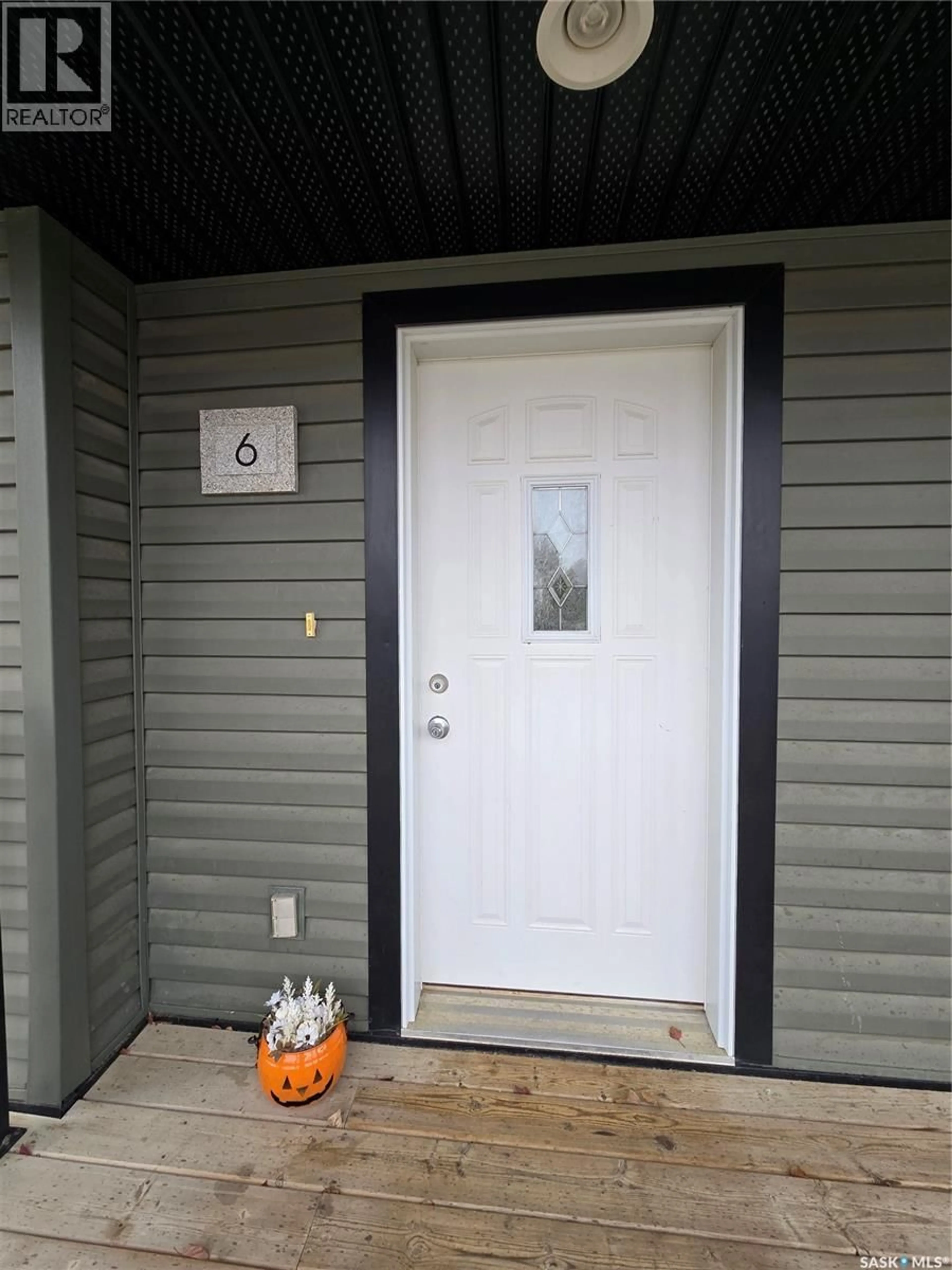 Home with vinyl exterior material, street for NE - 6 815 5TH STREET, Weyburn Saskatchewan S4H2K9