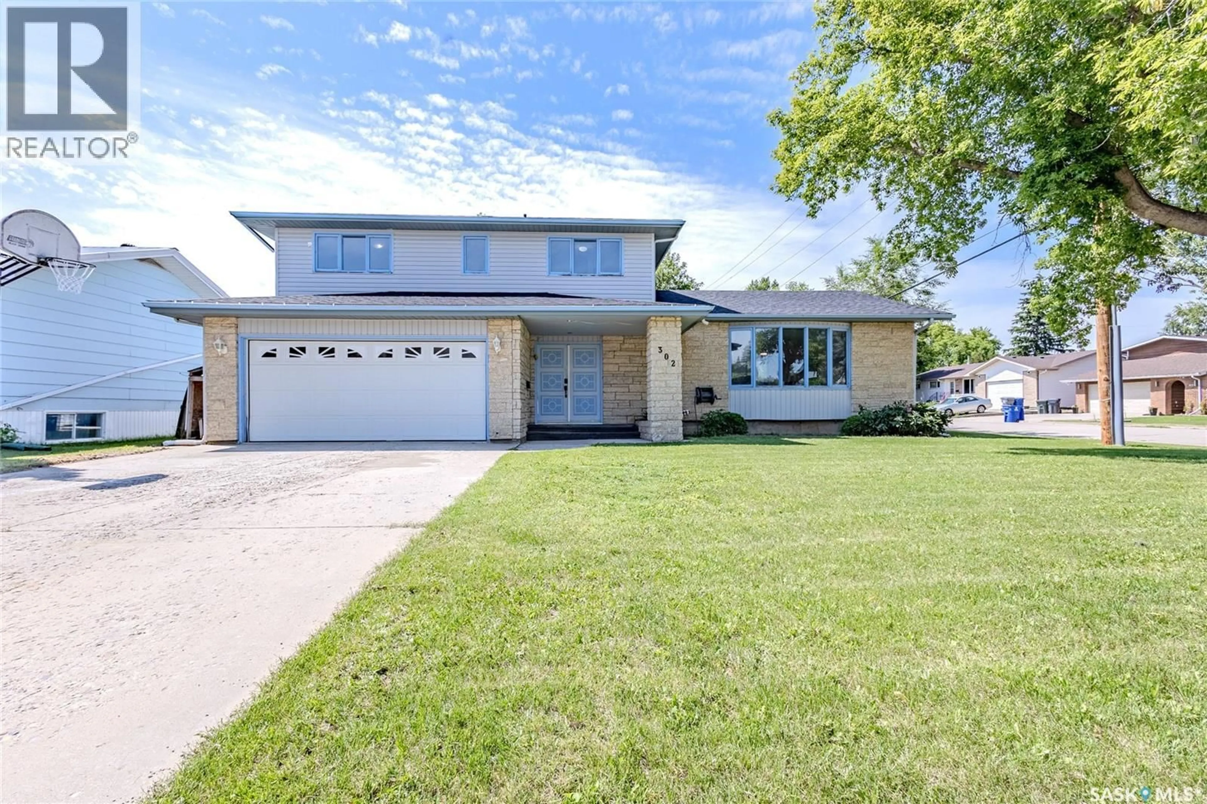 Home with brick exterior material, street for 302 4TH AVENUE, Langham Saskatchewan S0K2L0