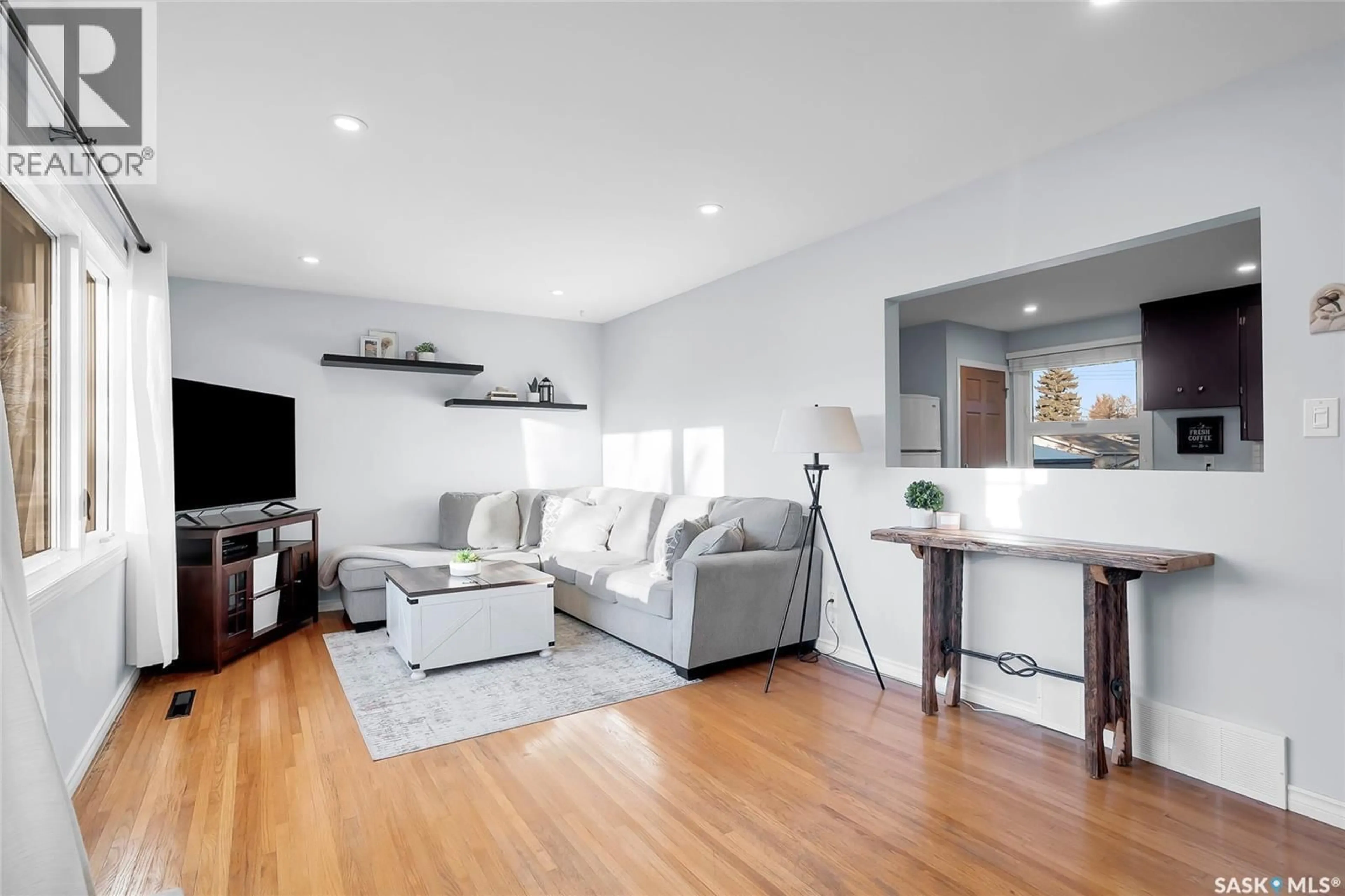 Living room with furniture, wood/laminate floor for 2221 HAULTAIN AVENUE, Saskatoon Saskatchewan S7J1P7