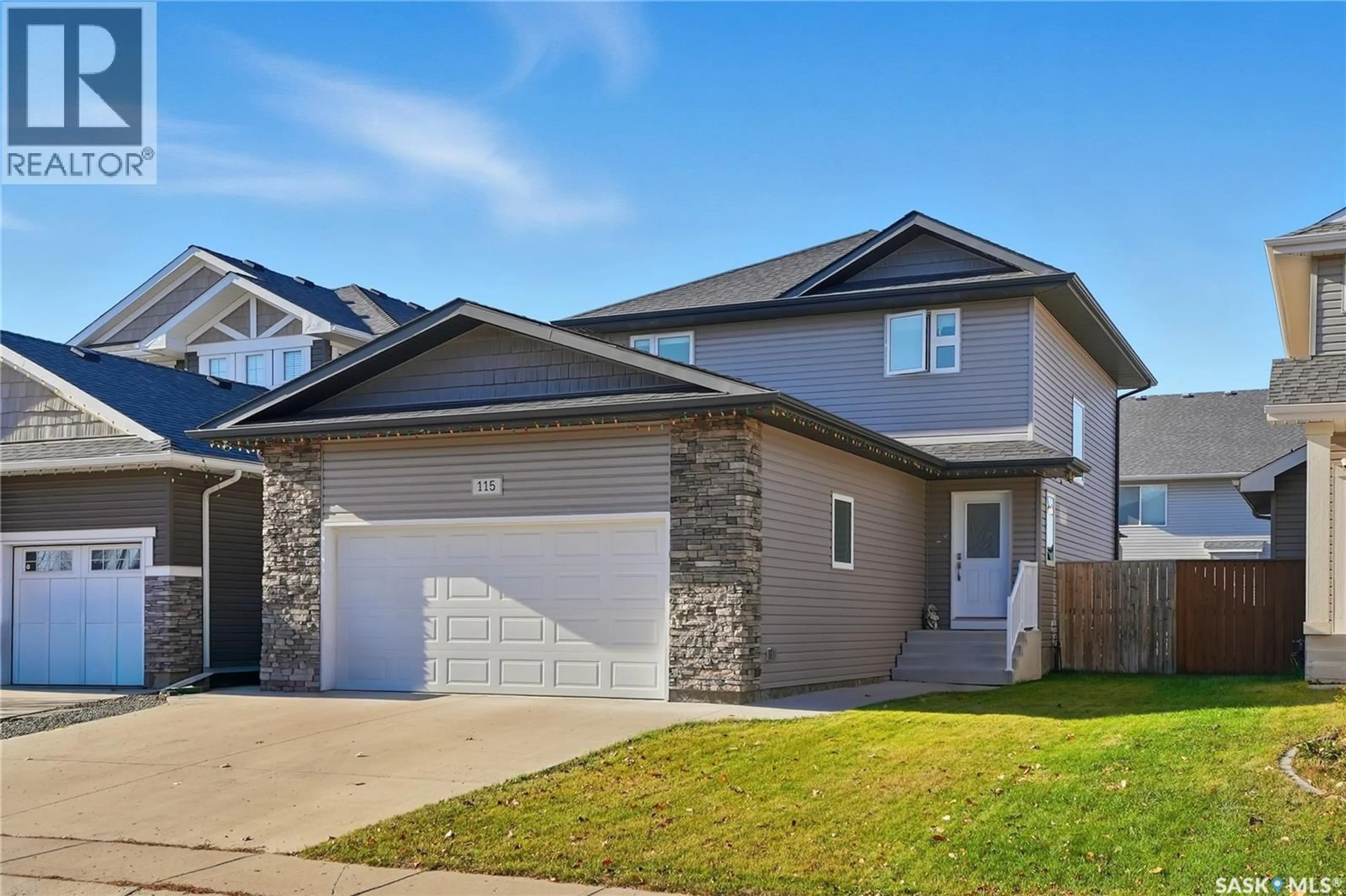 Home with vinyl exterior material, street for 115 CHILDERS CRESCENT, Saskatoon Saskatchewan S7L3G4