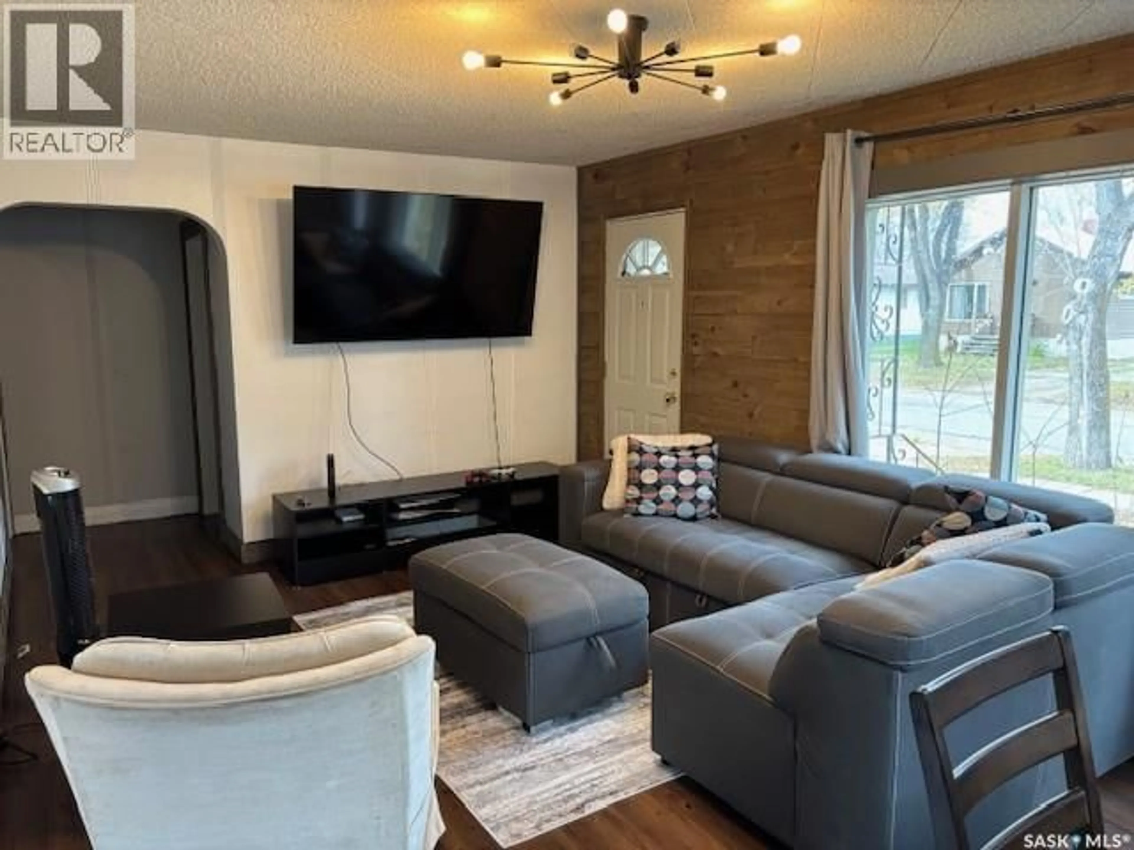 Living room with furniture, wood/laminate floor for 211 CANORA AVENUE, Canora Saskatchewan S0A0L0