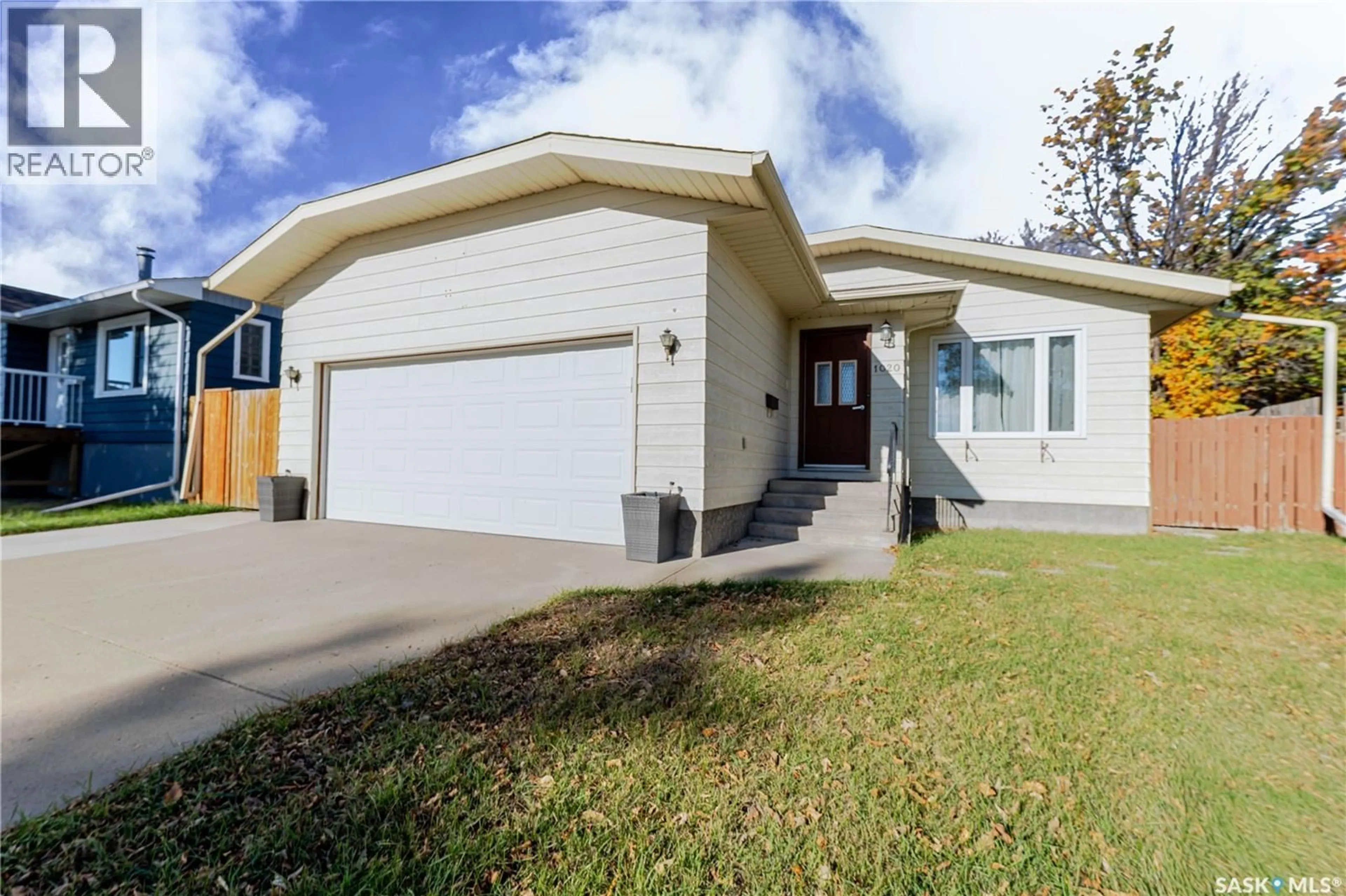 Home with vinyl exterior material, street for 1020 CARIBOU STREET, Moose Jaw Saskatchewan S6H2L7