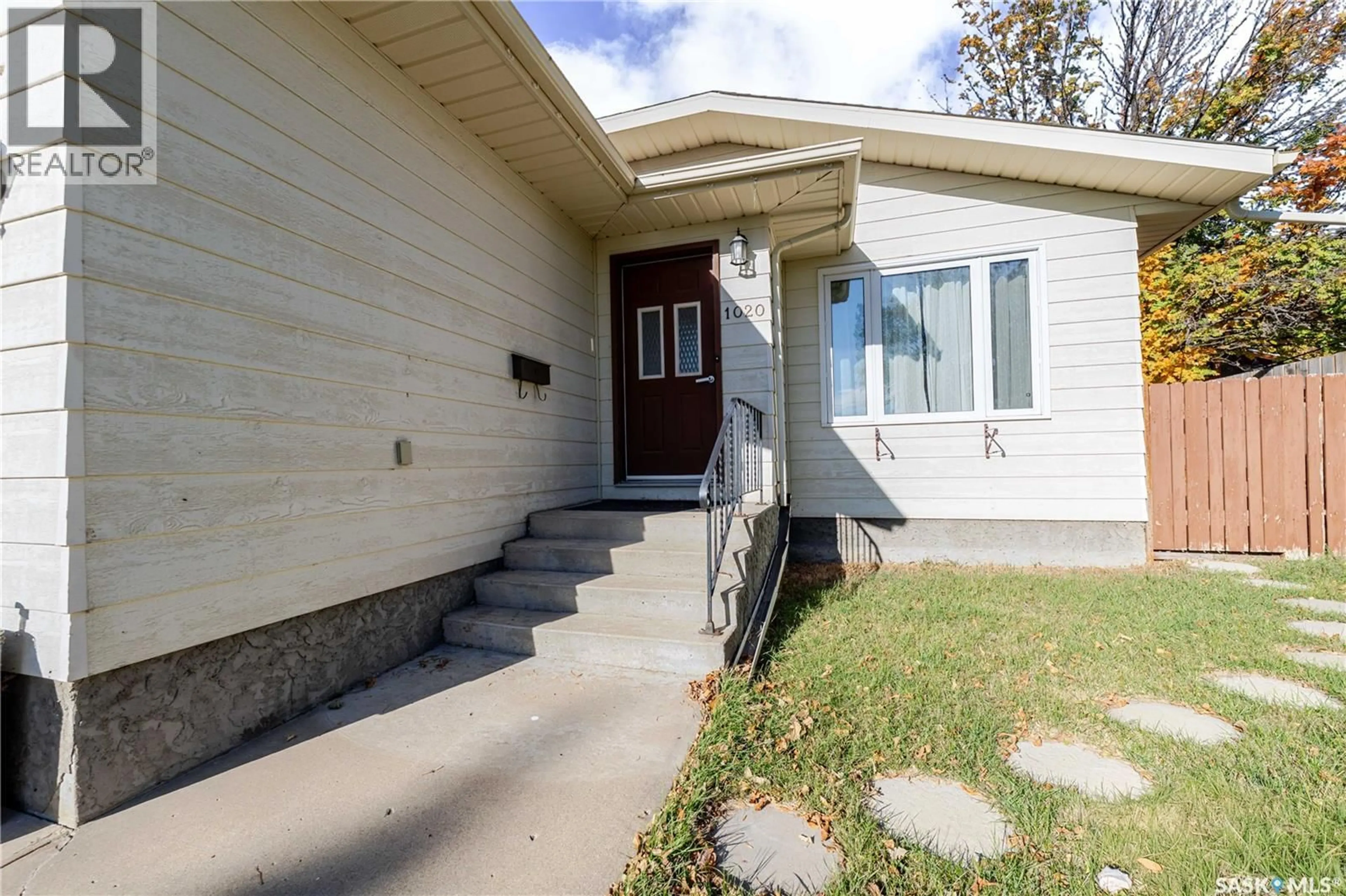 Home with vinyl exterior material, street for 1020 CARIBOU STREET, Moose Jaw Saskatchewan S6H2L7