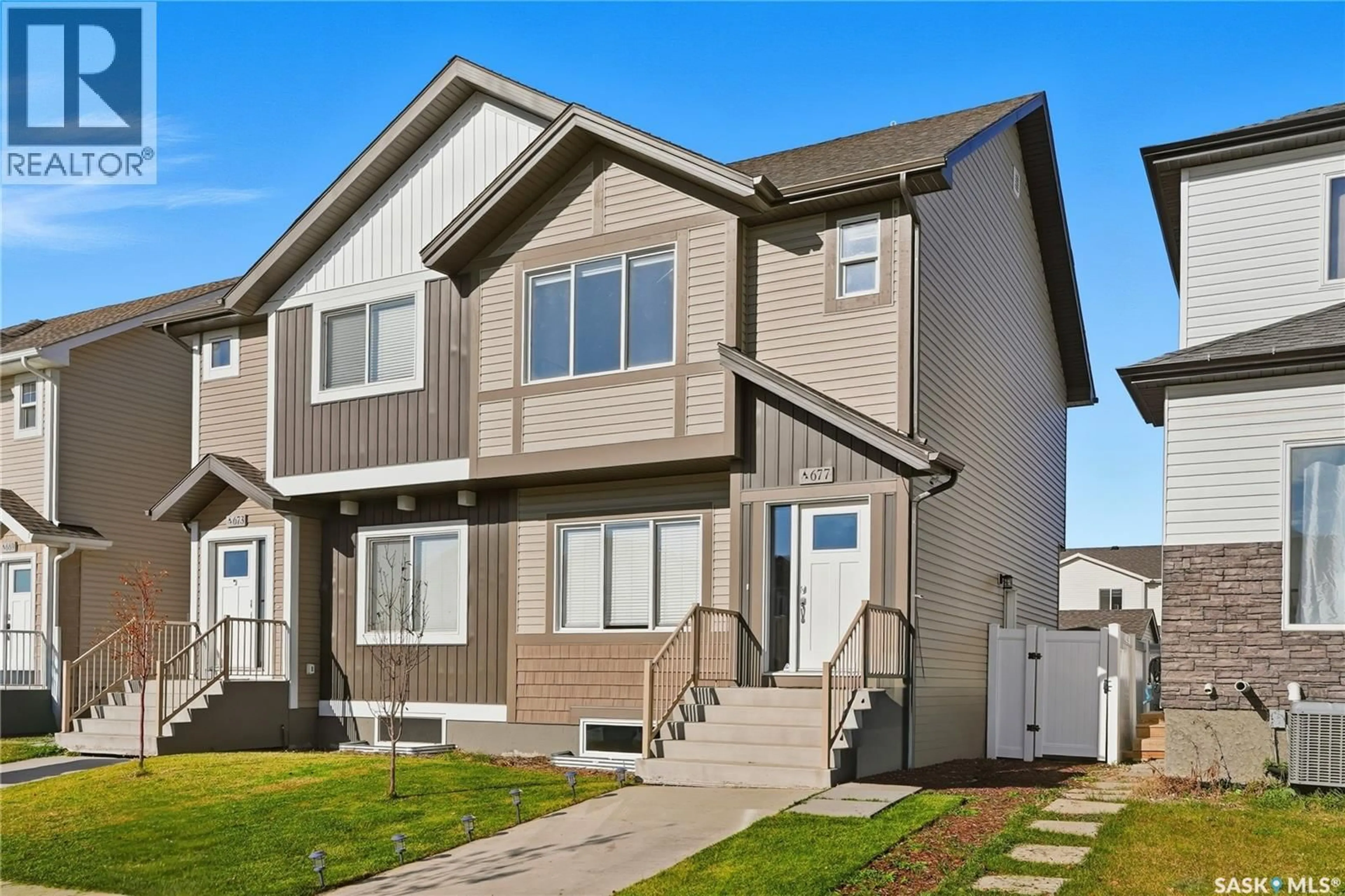 Home with vinyl exterior material, street for 677 FEHEREGYHAZI BOULEVARD, Saskatoon Saskatchewan S7W0Z4