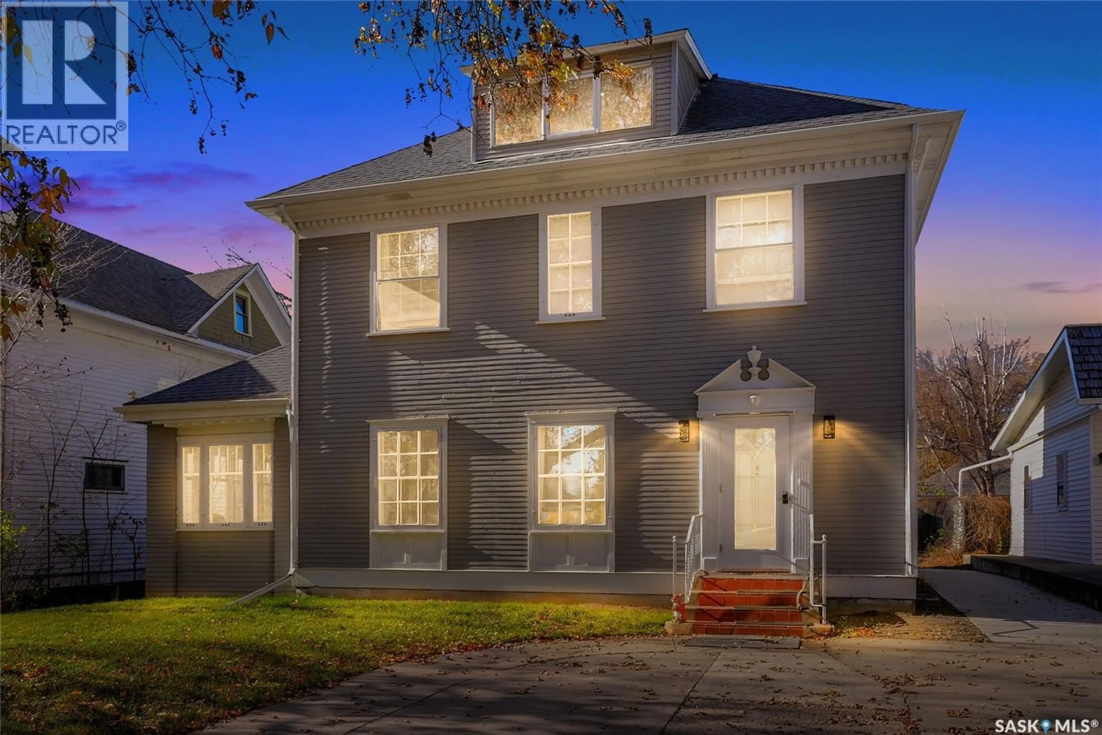 Home with brick exterior material, street for 1136 1ST AVENUE, Moose Jaw Saskatchewan S6H3N3