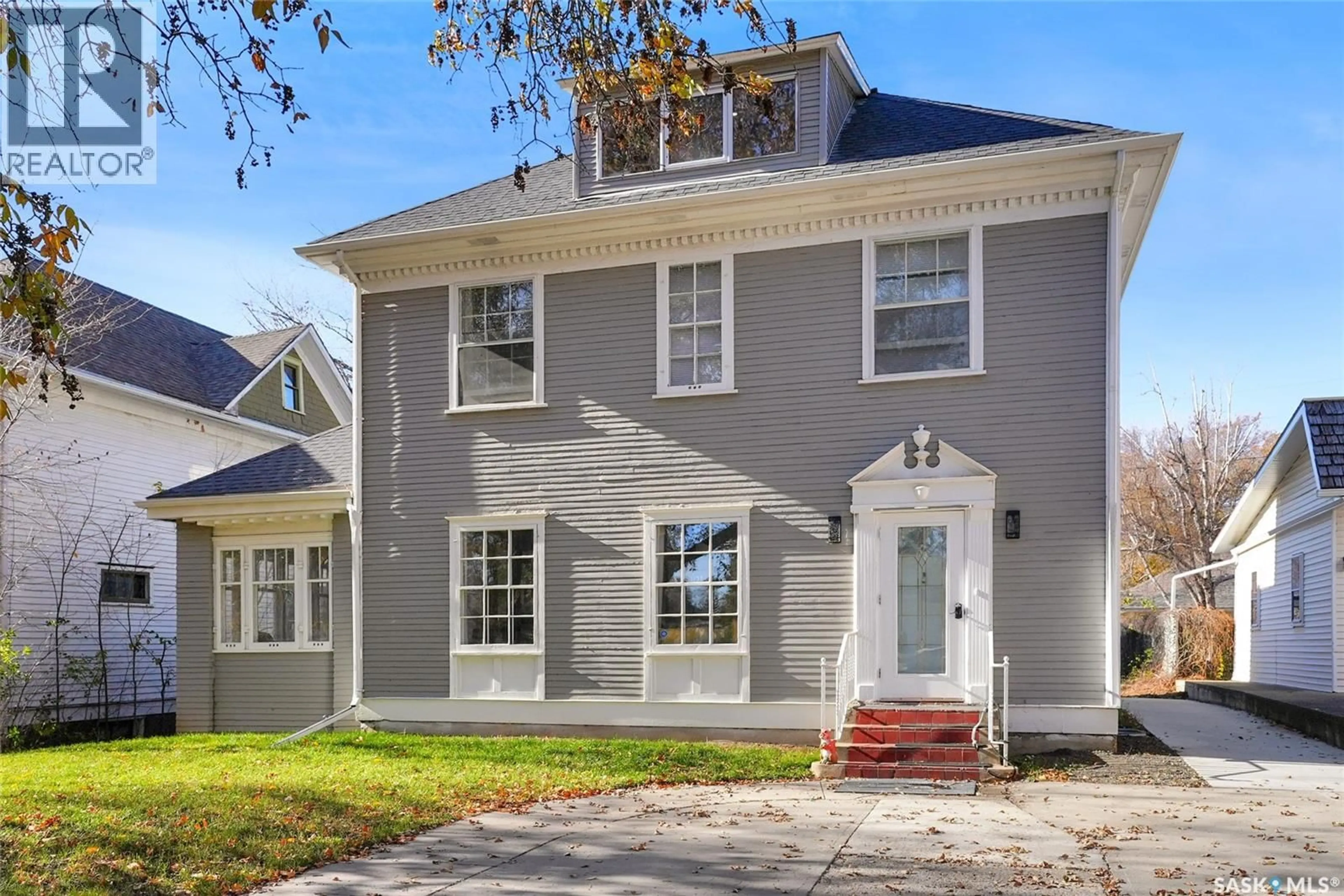 Home with brick exterior material, street for 1136 1ST AVENUE, Moose Jaw Saskatchewan S6H3N3