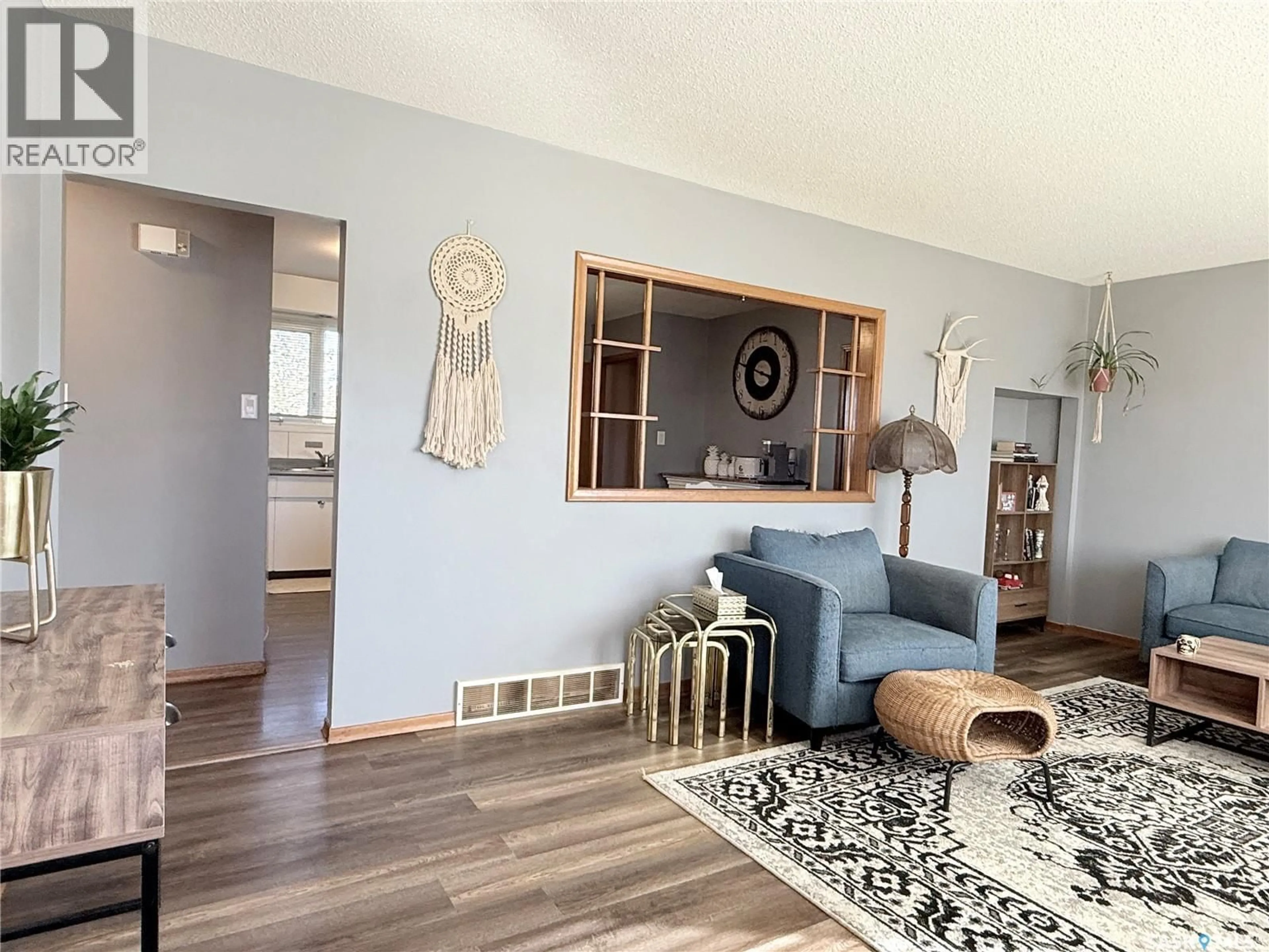 Living room with furniture, wood/laminate floor for 101 YOUNG STREET, Neudorf Saskatchewan S0A2T0
