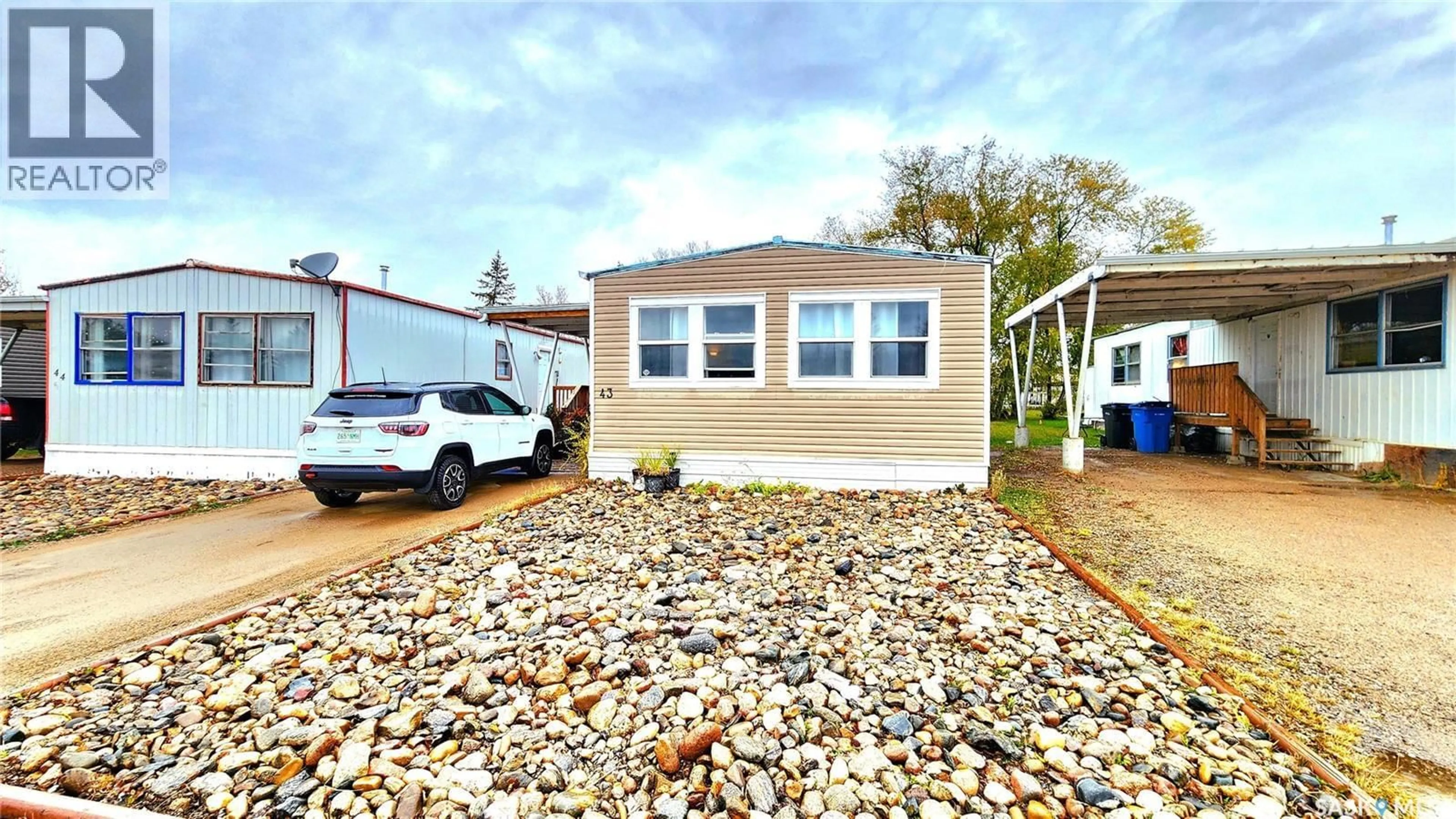Home with vinyl exterior material, street for 1401 - 43 114TH STREET, North Battleford Saskatchewan S9A3G4