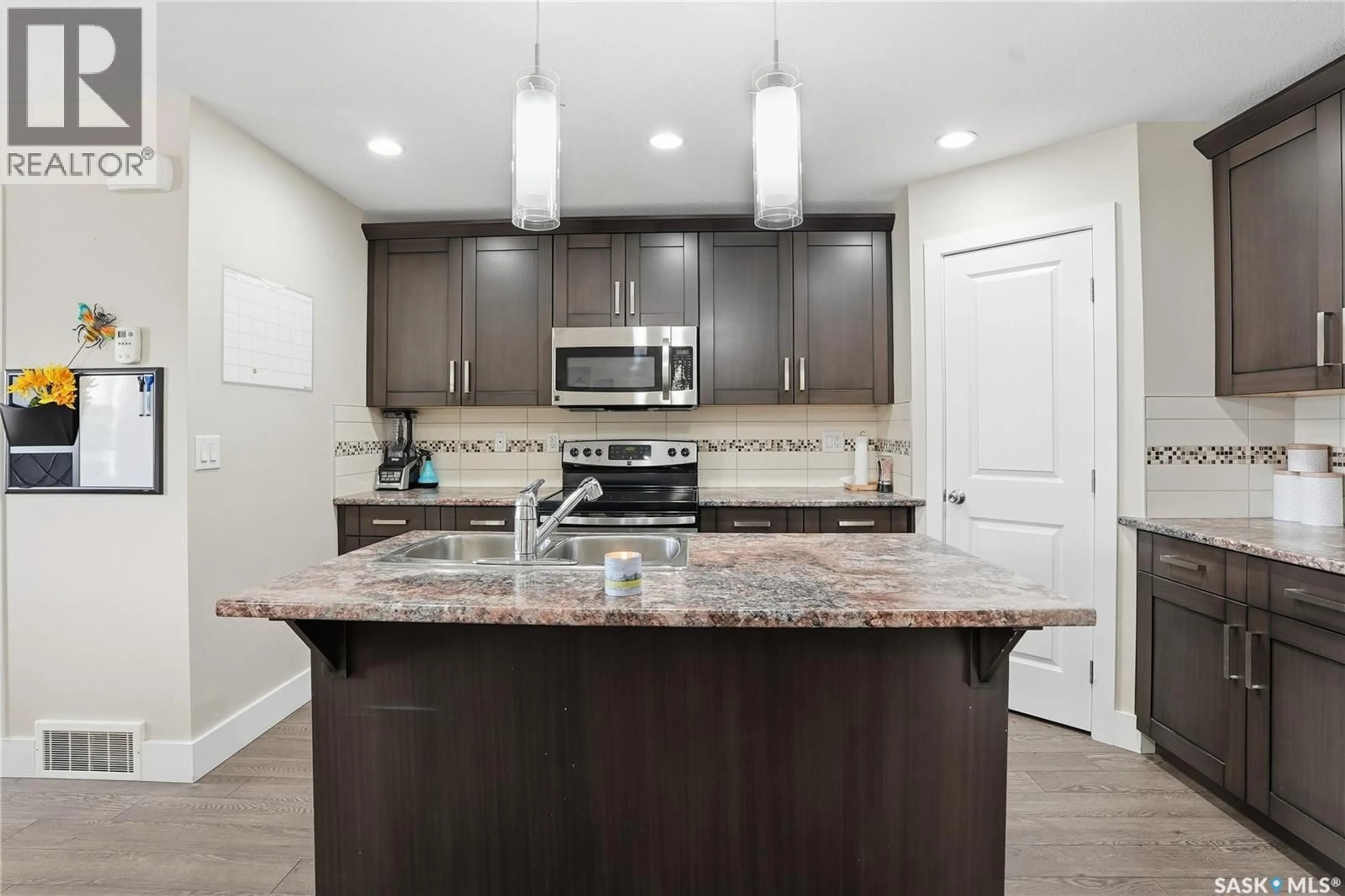 Open concept kitchen, ceramic/tile floor for N - 5 29 1ST AVENUE, Martensville Saskatchewan S0K2T0