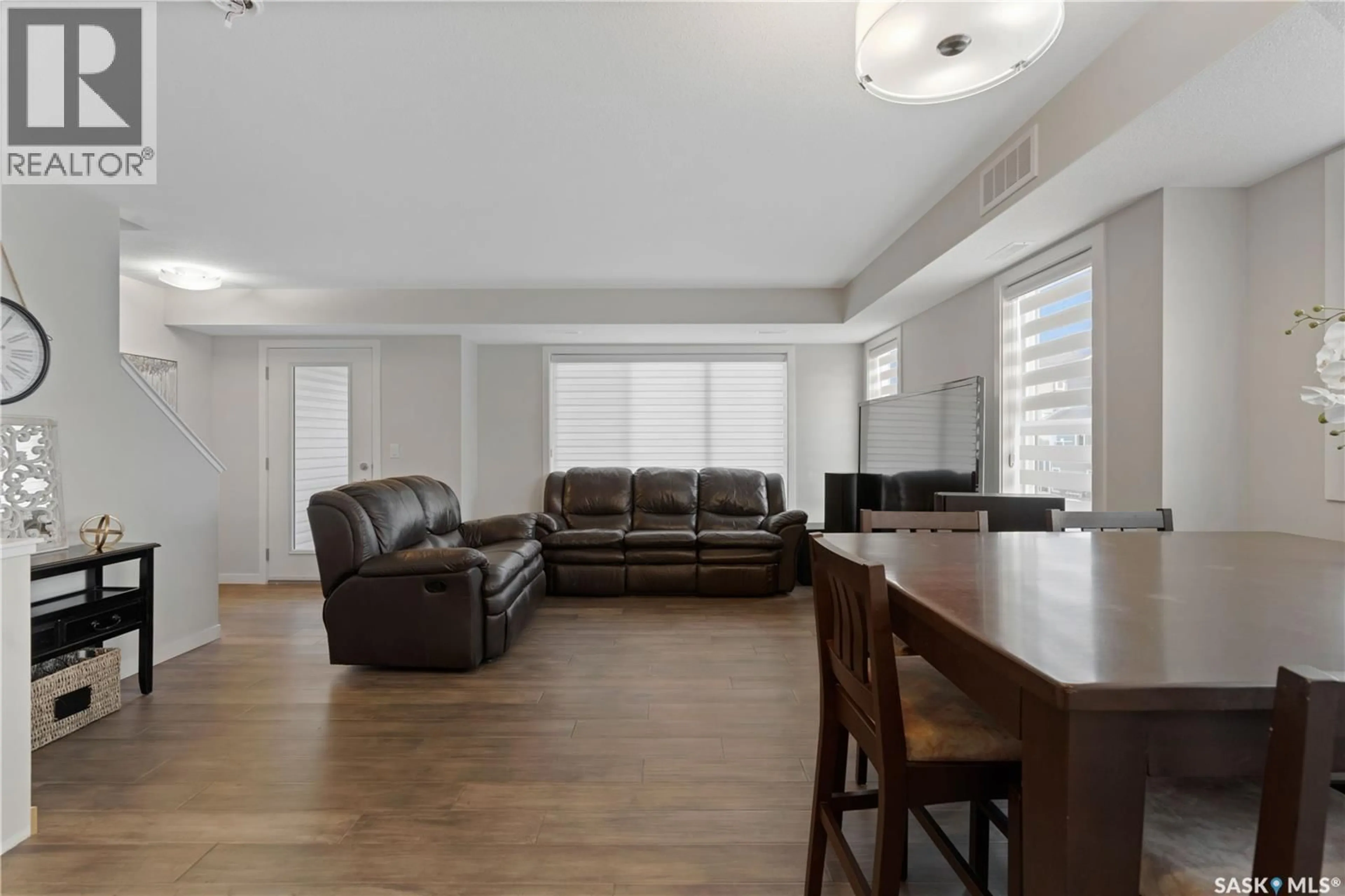 Living room with furniture, unknown for 206 - 3351 GREEN POPPY STREET, Regina Saskatchewan S4V3P6