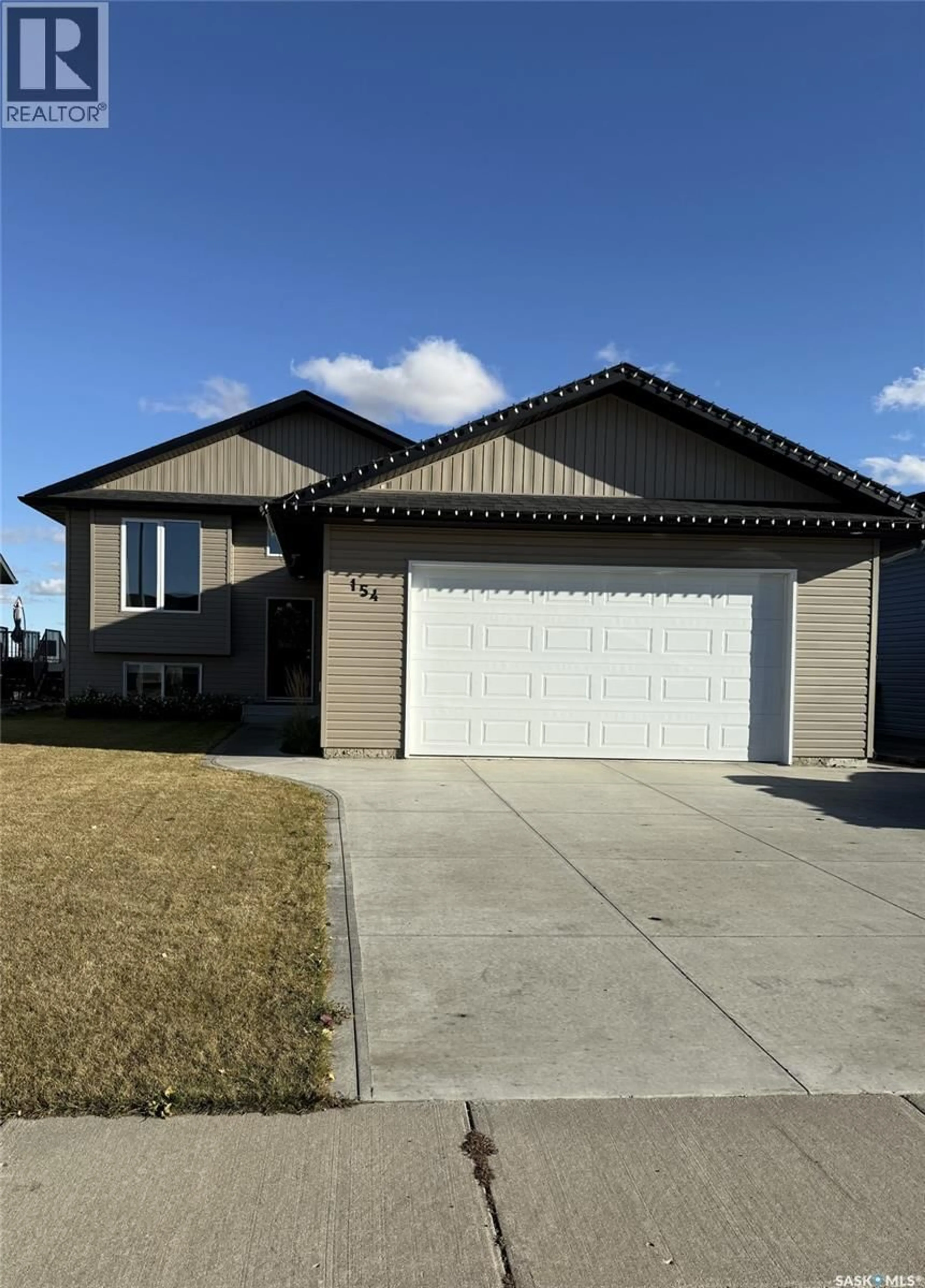 Home with vinyl exterior material, street for 154 FINCH CRESCENT, Langham Saskatchewan S0K2L0