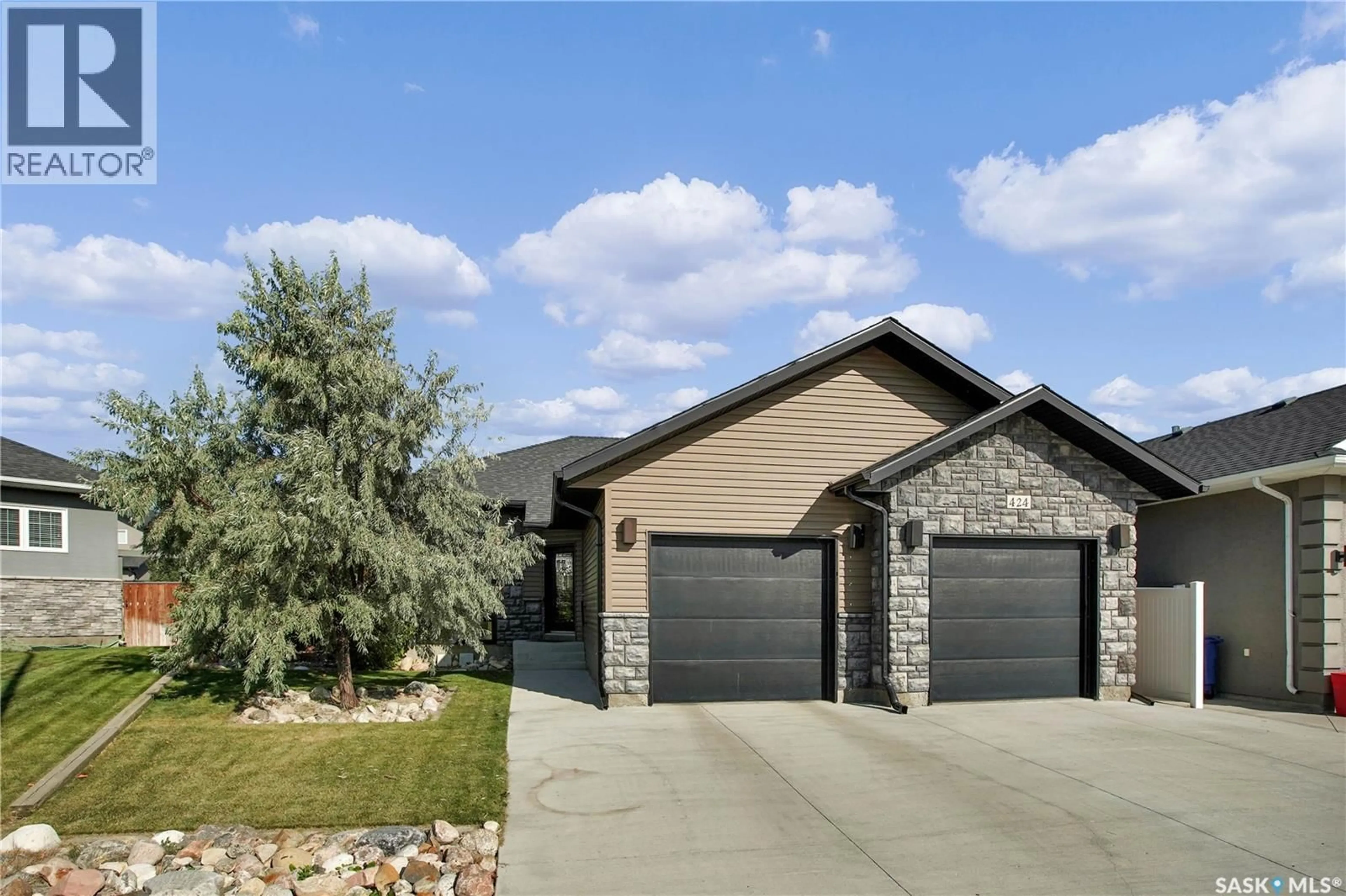 Home with brick exterior material, street for 424 LYLE CRESCENT, Warman Saskatchewan S0K4S1