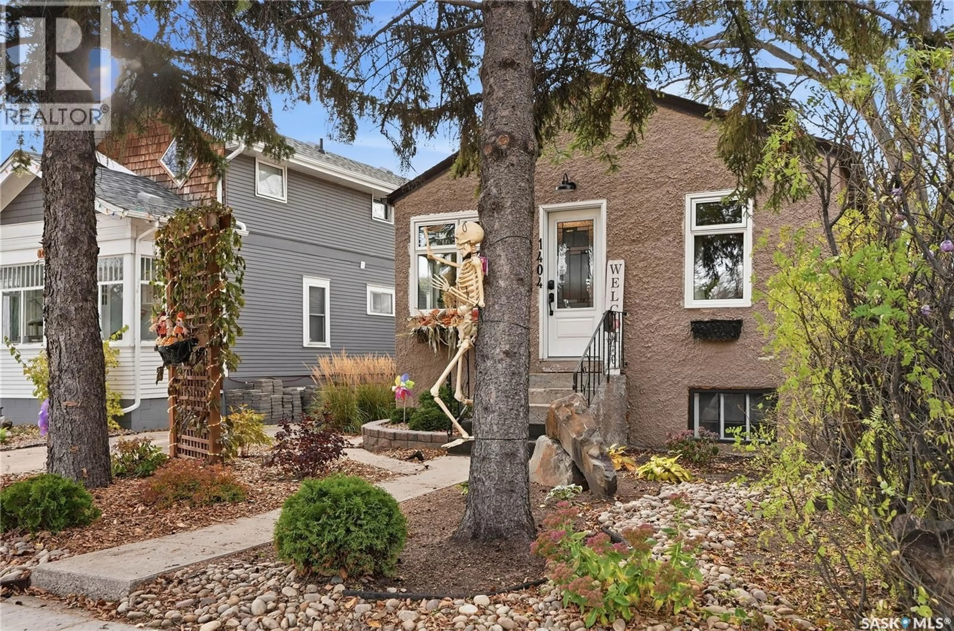 Home with brick exterior material, street for 1404 LORNE AVENUE, Saskatoon Saskatchewan S7H1X7