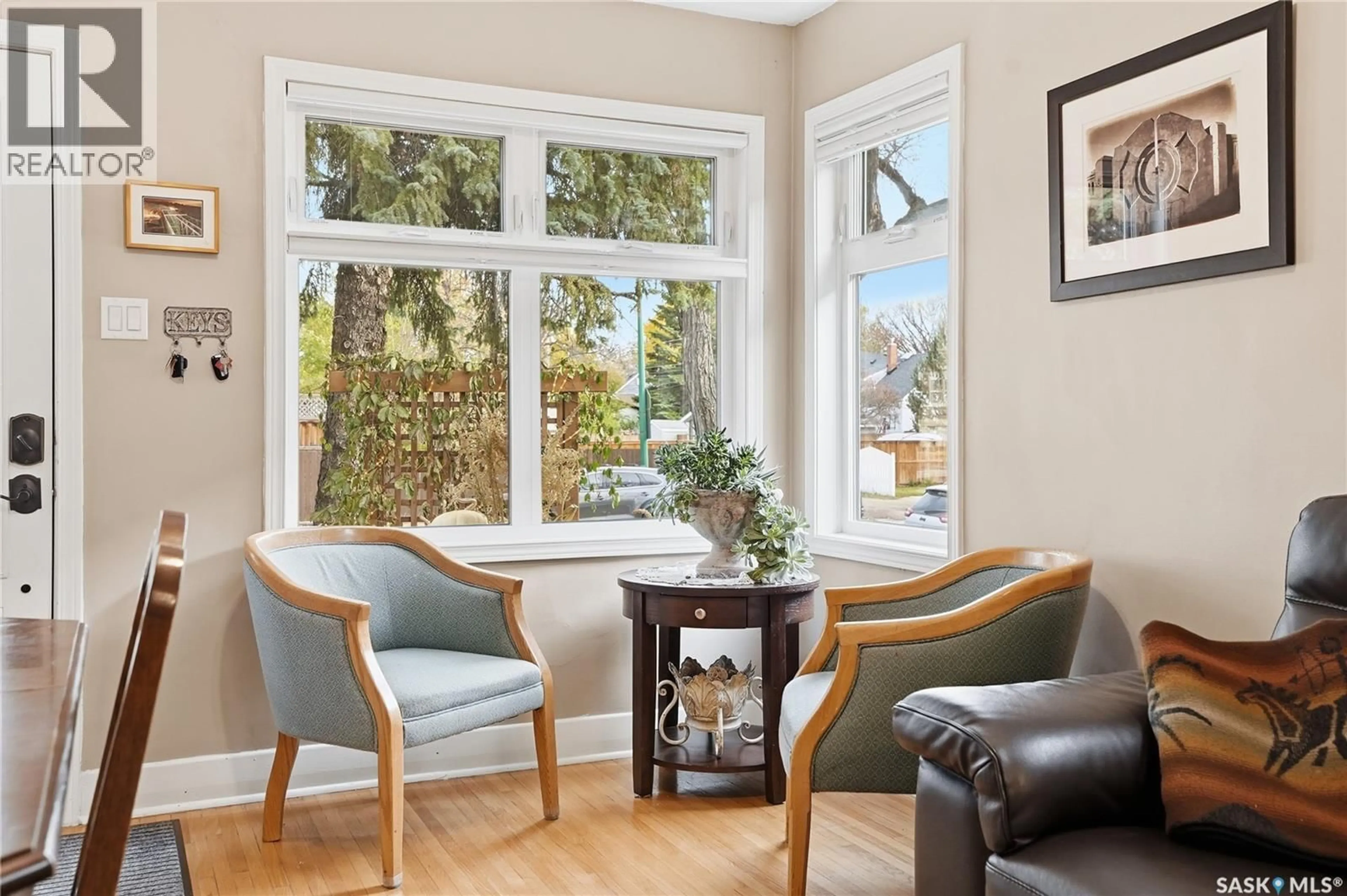 Living room with furniture, wood/laminate floor for 1404 LORNE AVENUE, Saskatoon Saskatchewan S7H1X7