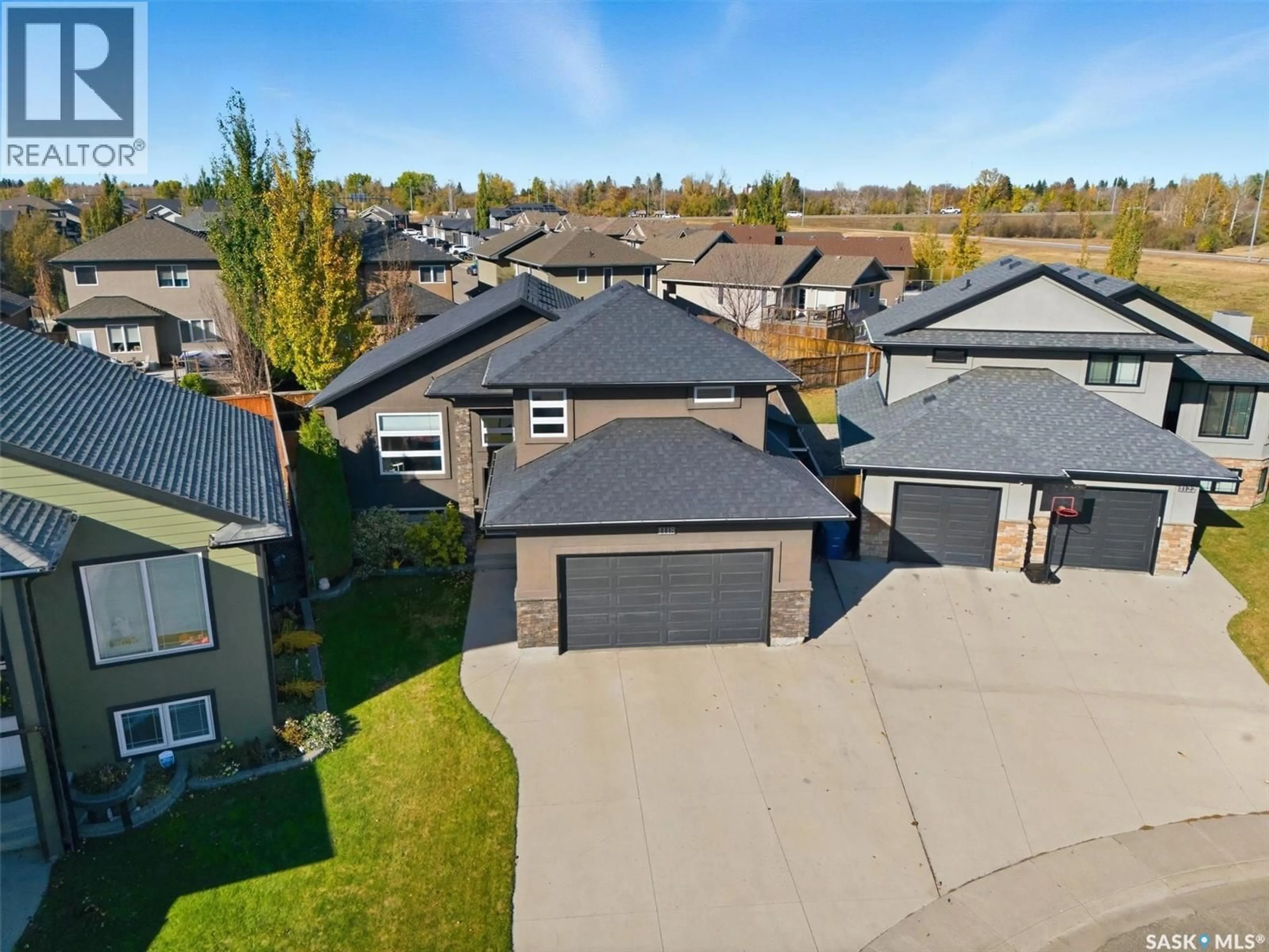 A pic from outside/outdoor area/front of a property/back of a property/a pic from drone, street for 1118 REMPEL PLACE, Saskatoon Saskatchewan S7T0M2