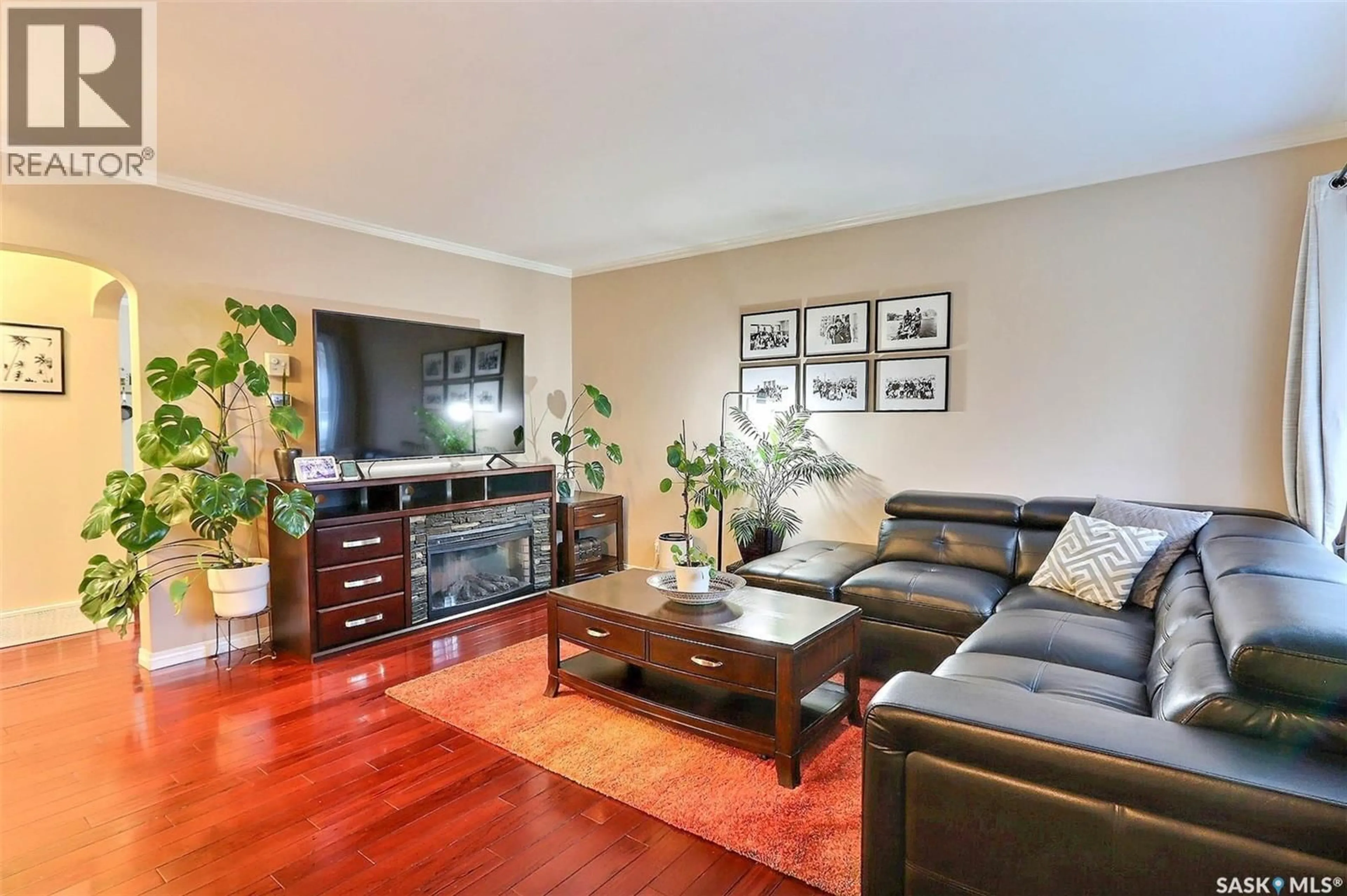 Living room with furniture, wood/laminate floor for 518 20TH STREET, Prince Albert Saskatchewan S6V1L3