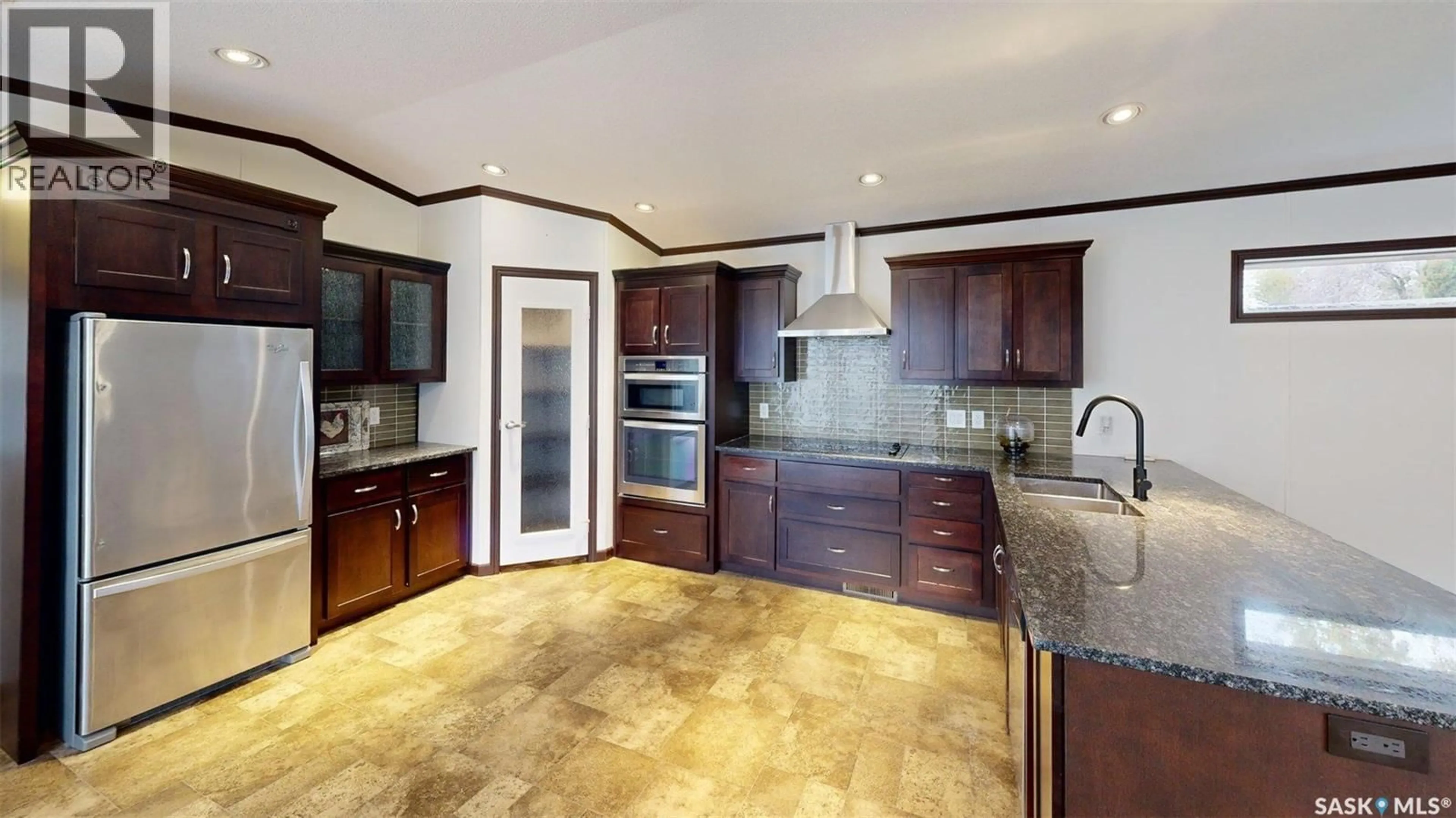 Open concept kitchen, ceramic/tile floor for 61 WALTERS COURT, Pilot Butte Saskatchewan S0G3Z0