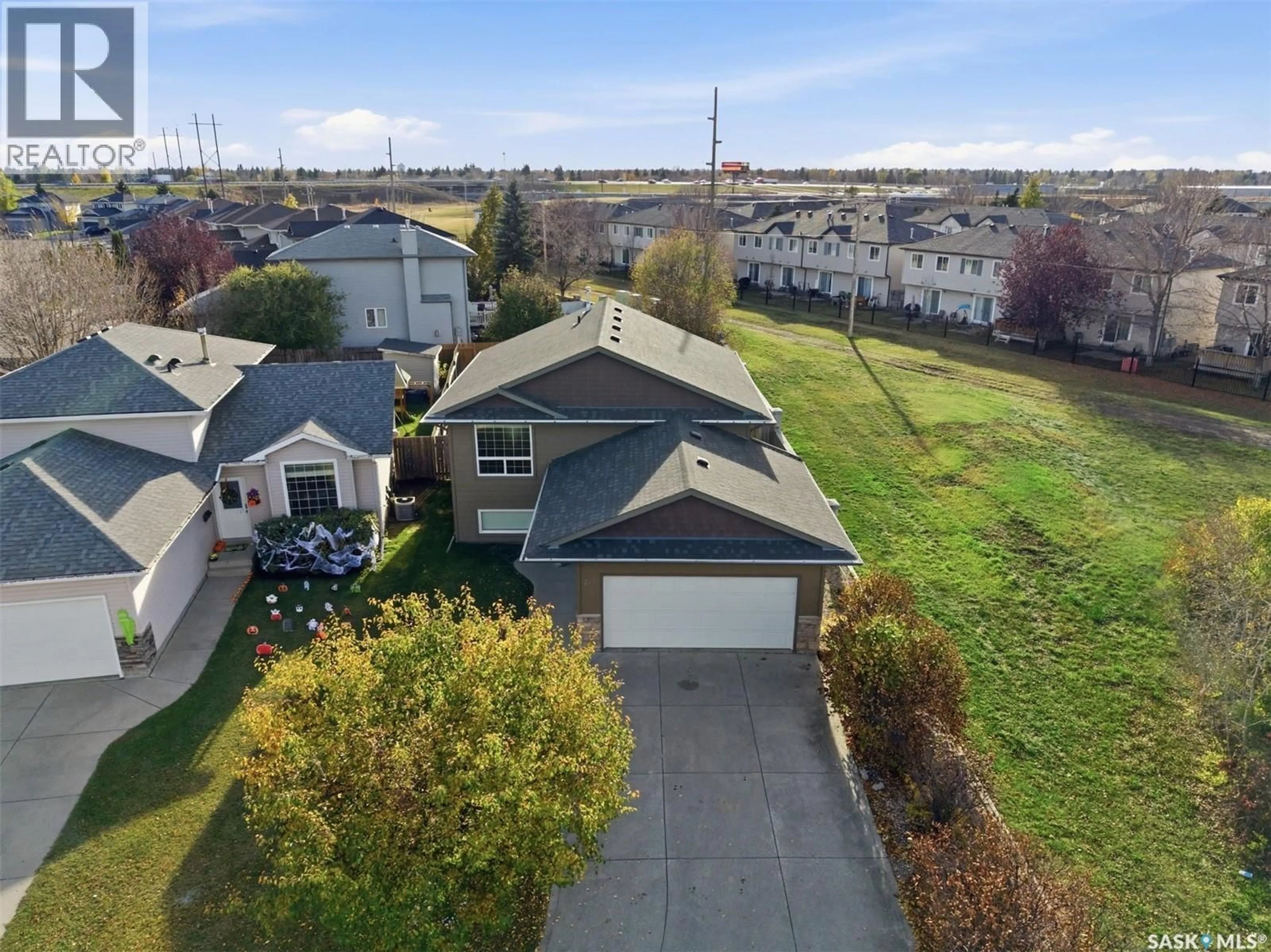 A pic from outside/outdoor area/front of a property/back of a property/a pic from drone, street for 710 KENDERDINE ROAD, Saskatoon Saskatchewan S7N4V8