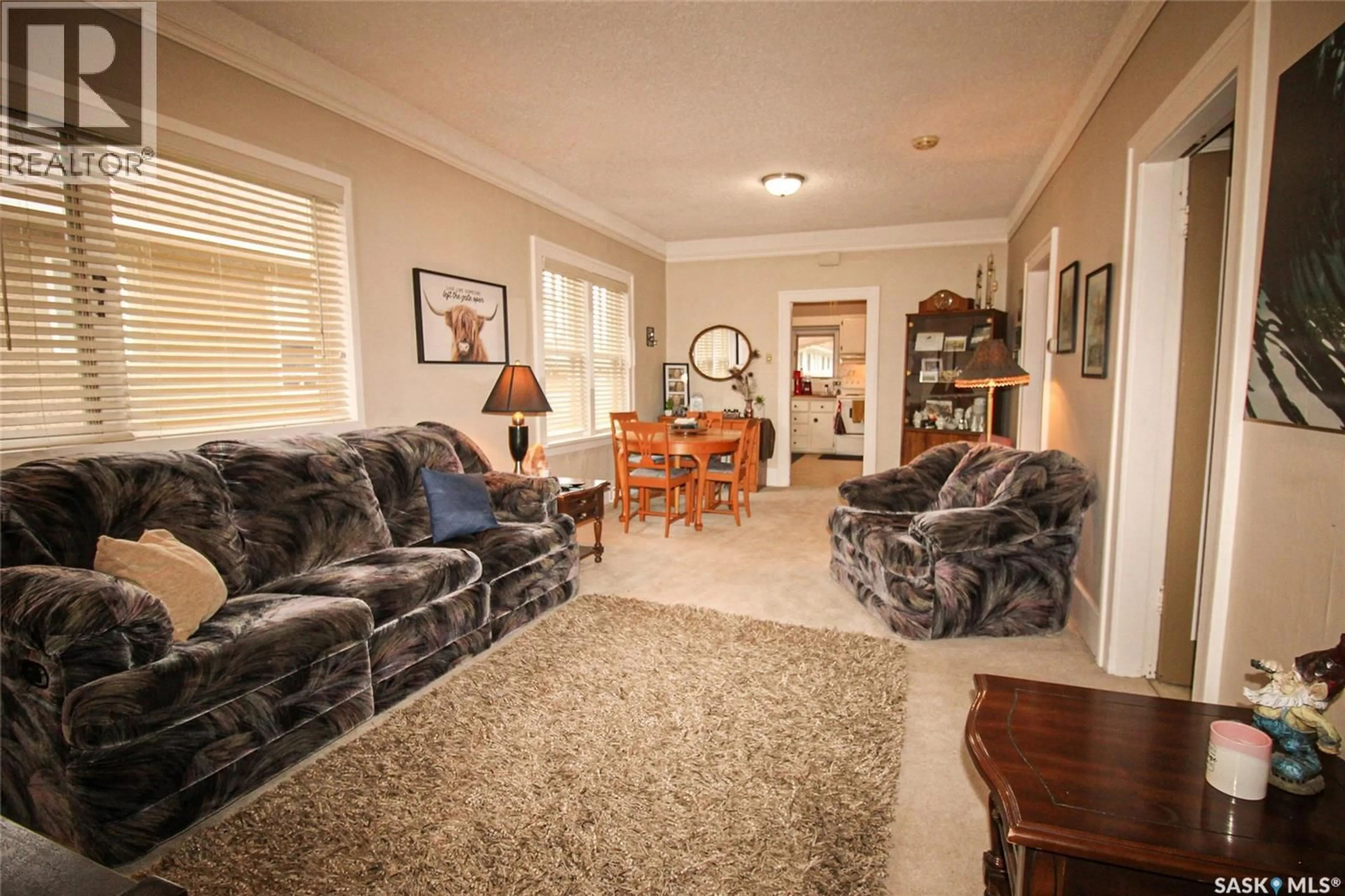 Living room with furniture, carpet floor for 515 1ST STREET, Shaunavon Saskatchewan S0N2M0