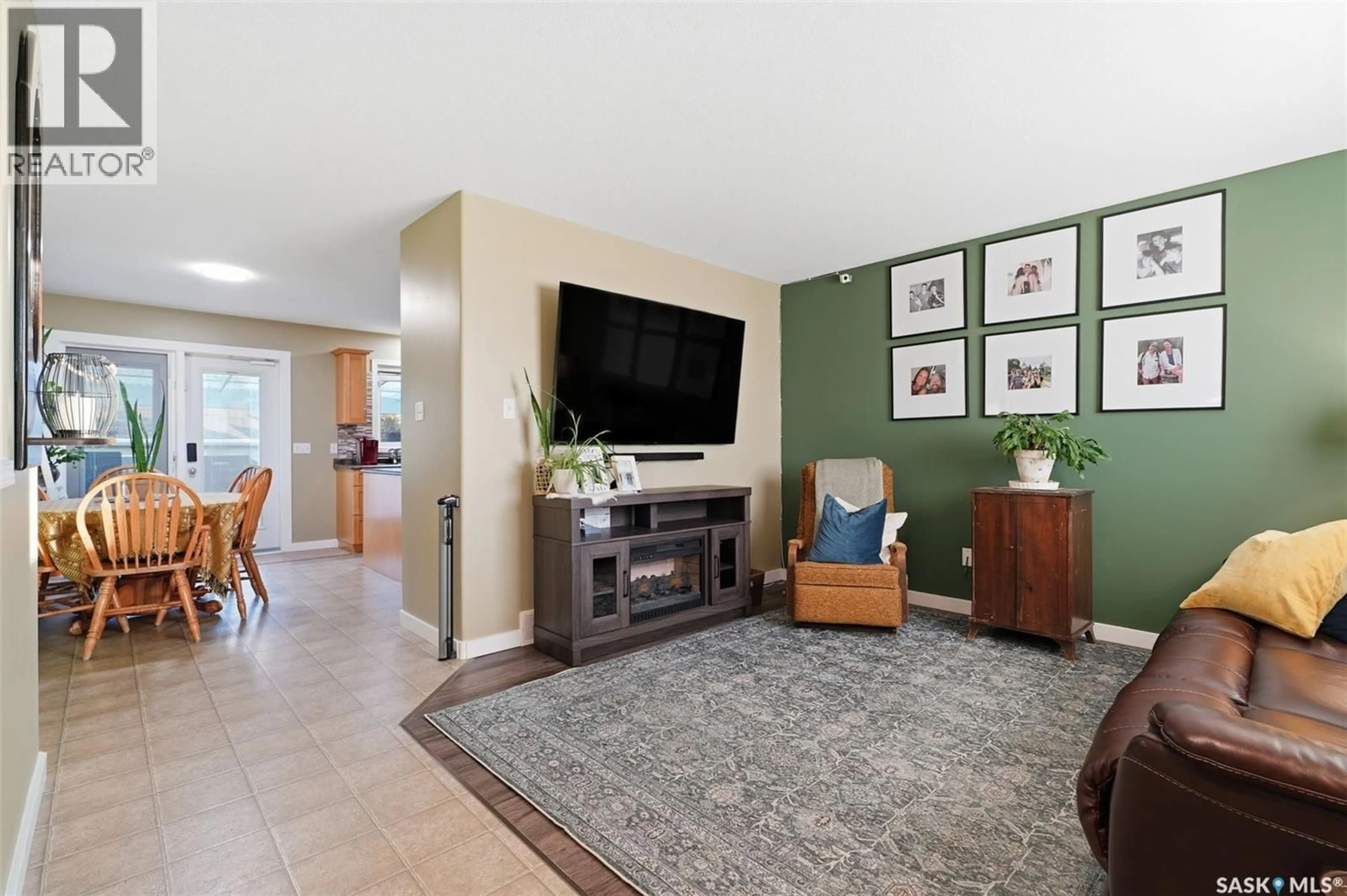 Living room with furniture, ceramic/tile floor for 301 1ST AVENUE N, Martensville Saskatchewan S0K2T2