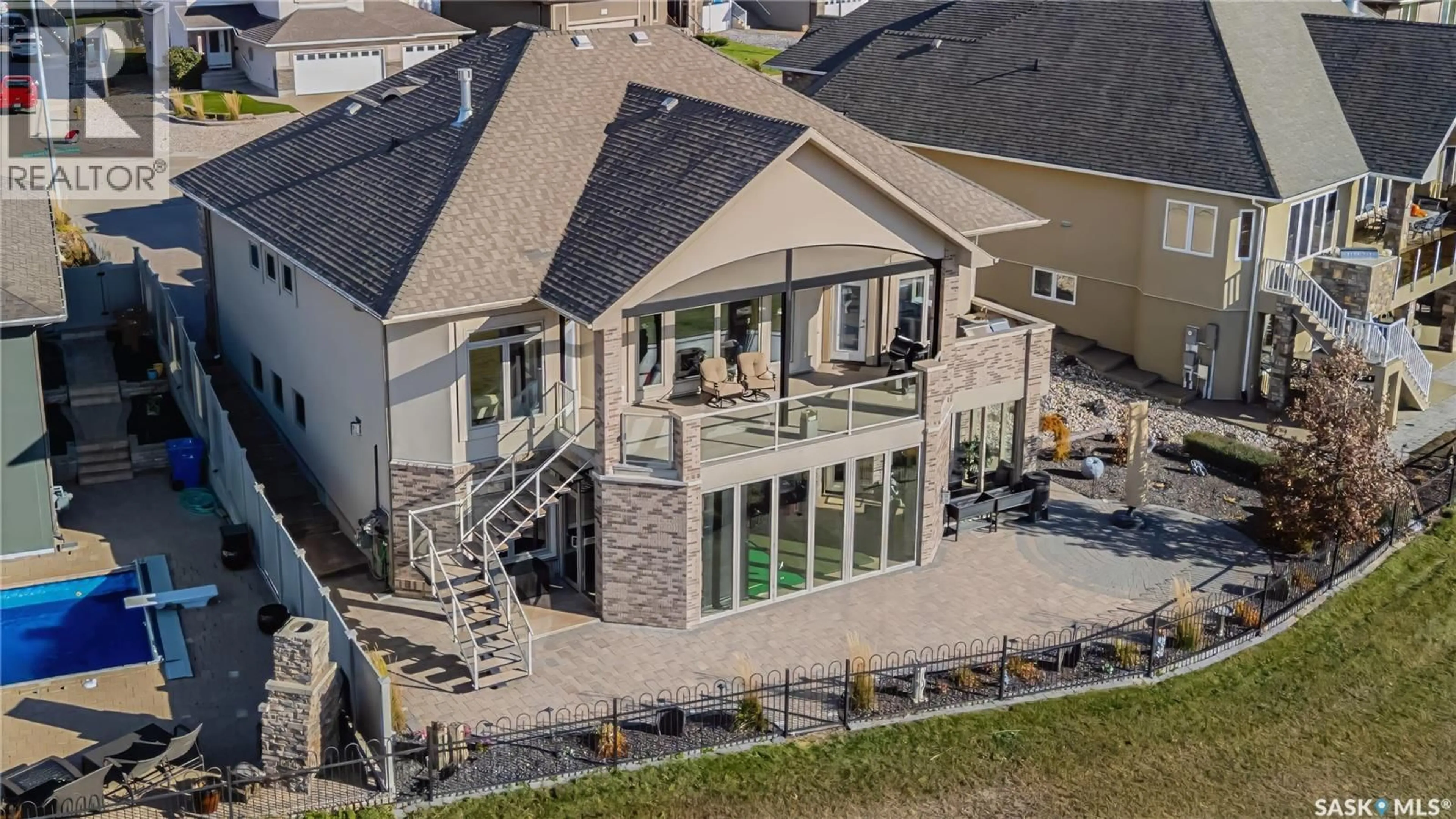 A pic from outside/outdoor area/front of a property/back of a property/a pic from drone, unknown for 8099 WASCANA GARDENS CRESCENT, Regina Saskatchewan S4V1G2