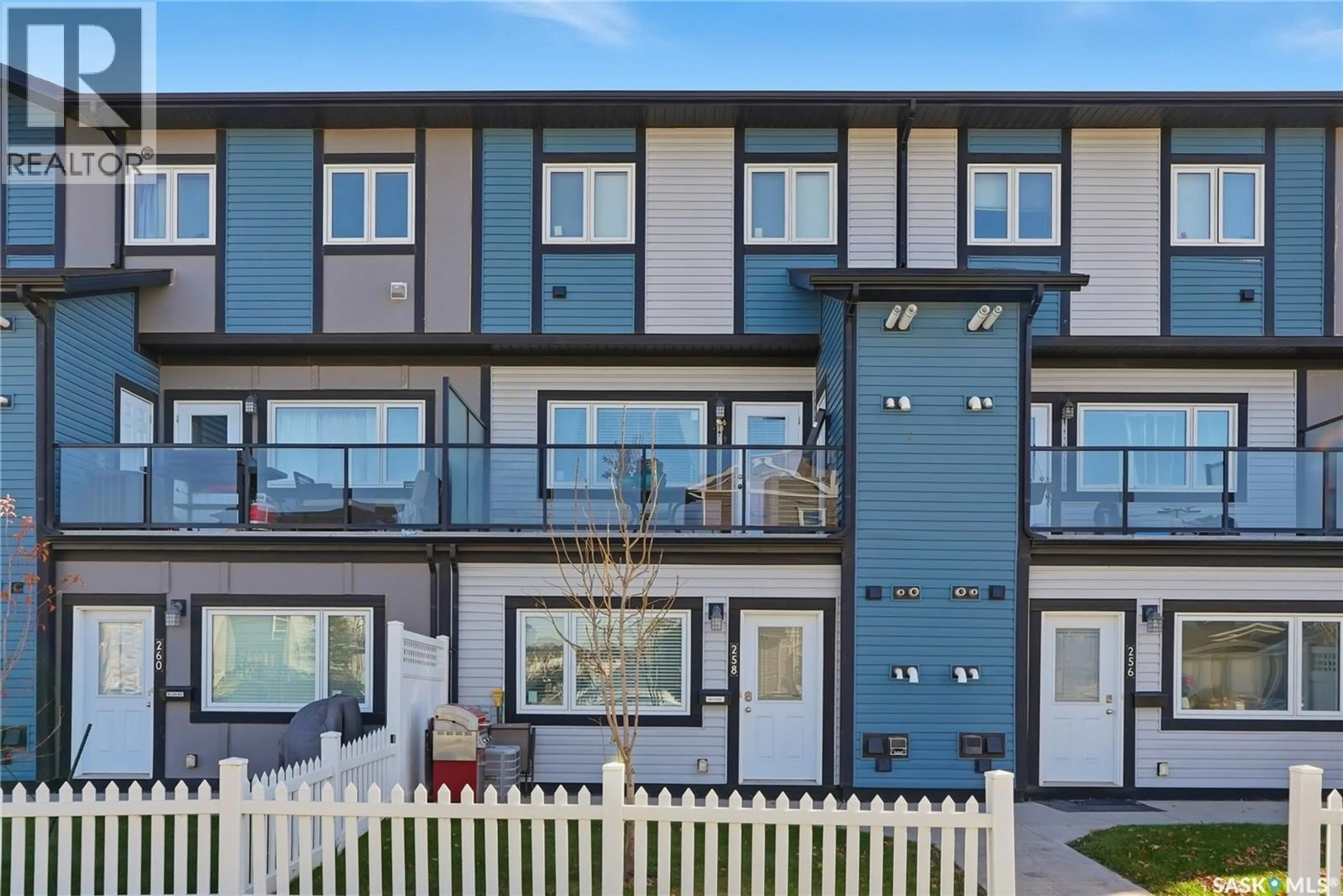 Home with vinyl exterior material, street for 250 - 258 AKHTAR BEND, Saskatoon Saskatchewan S7W0W4