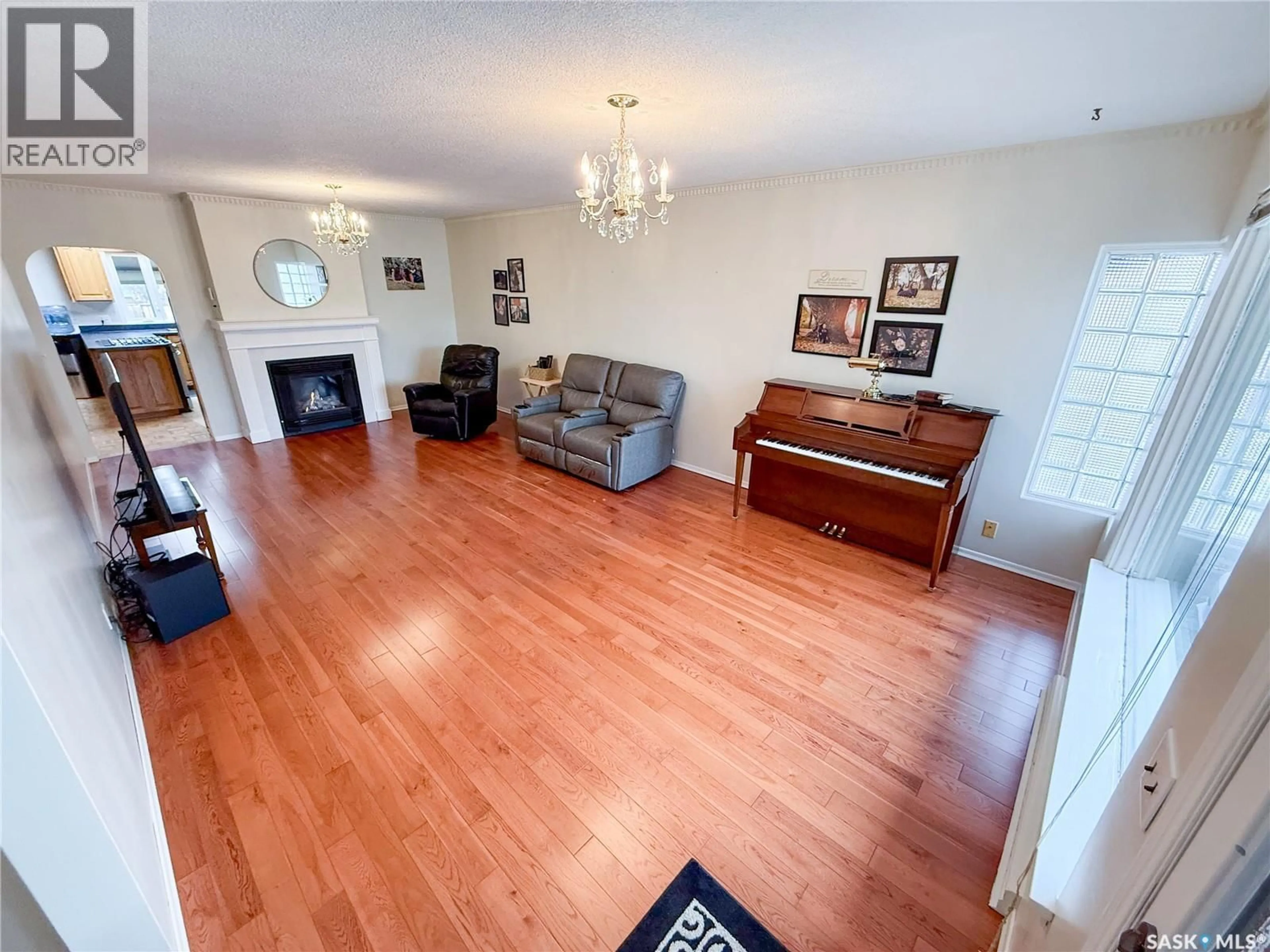 Living room with furniture, wood/laminate floor for 220 1ST STREET, Ponteix Saskatchewan S0N1Z0