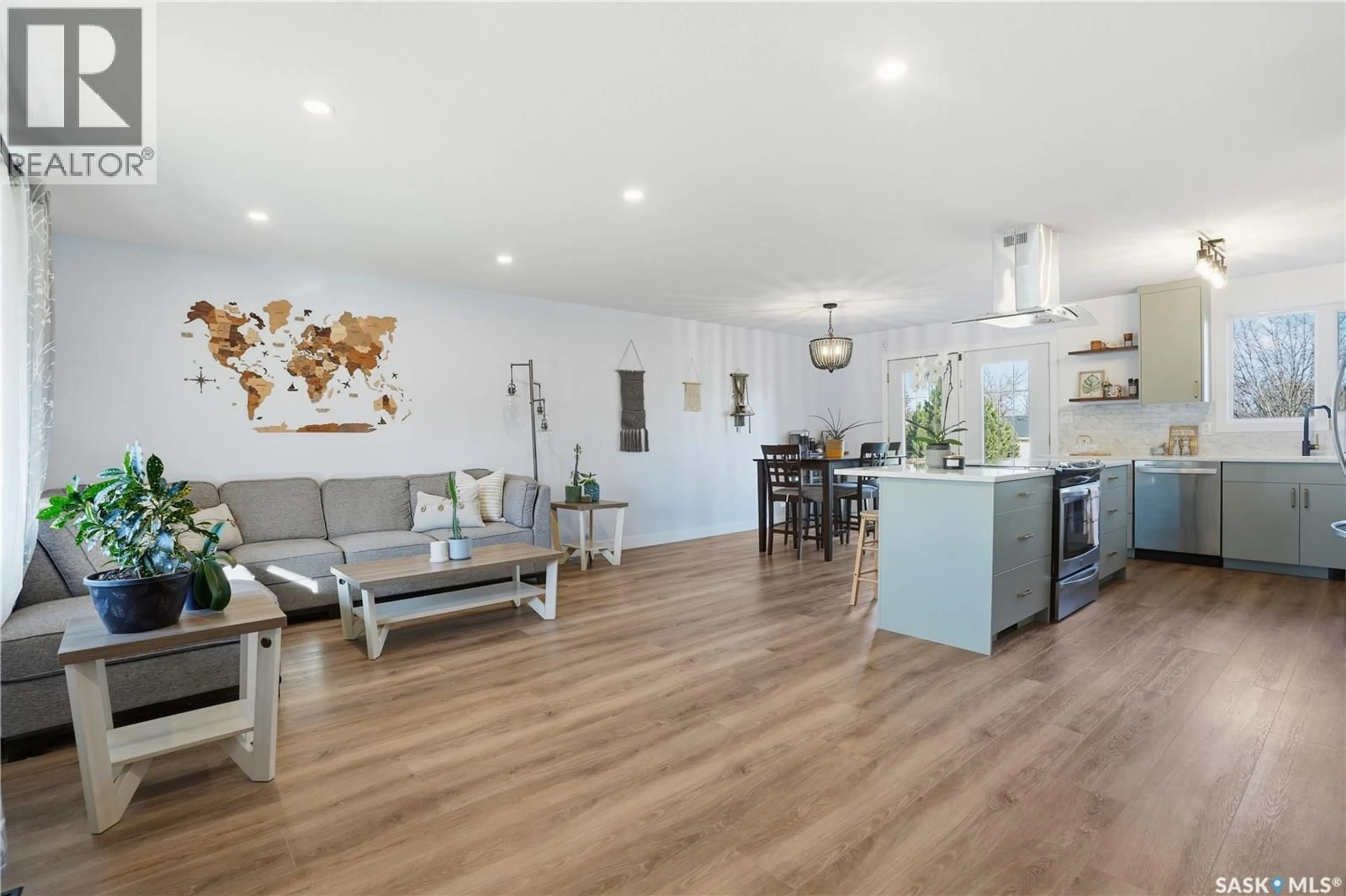 Open concept kitchen, wood/laminate floor for 415 WATHAMAN CRESCENT, Saskatoon Saskatchewan S7K4P8