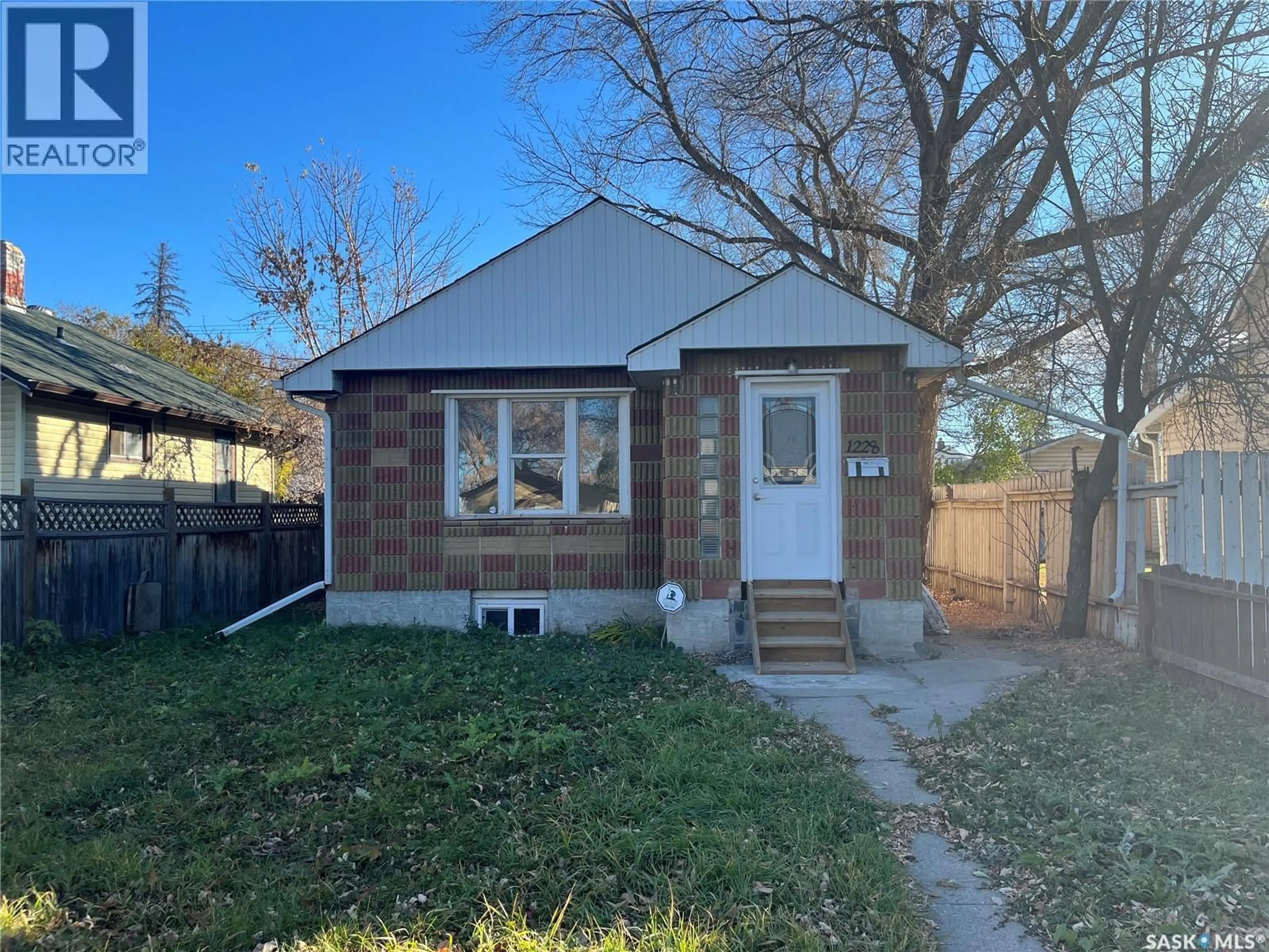Home with brick exterior material, street for 1228 1ST AVENUE, Saskatoon Saskatchewan S7K1Y6