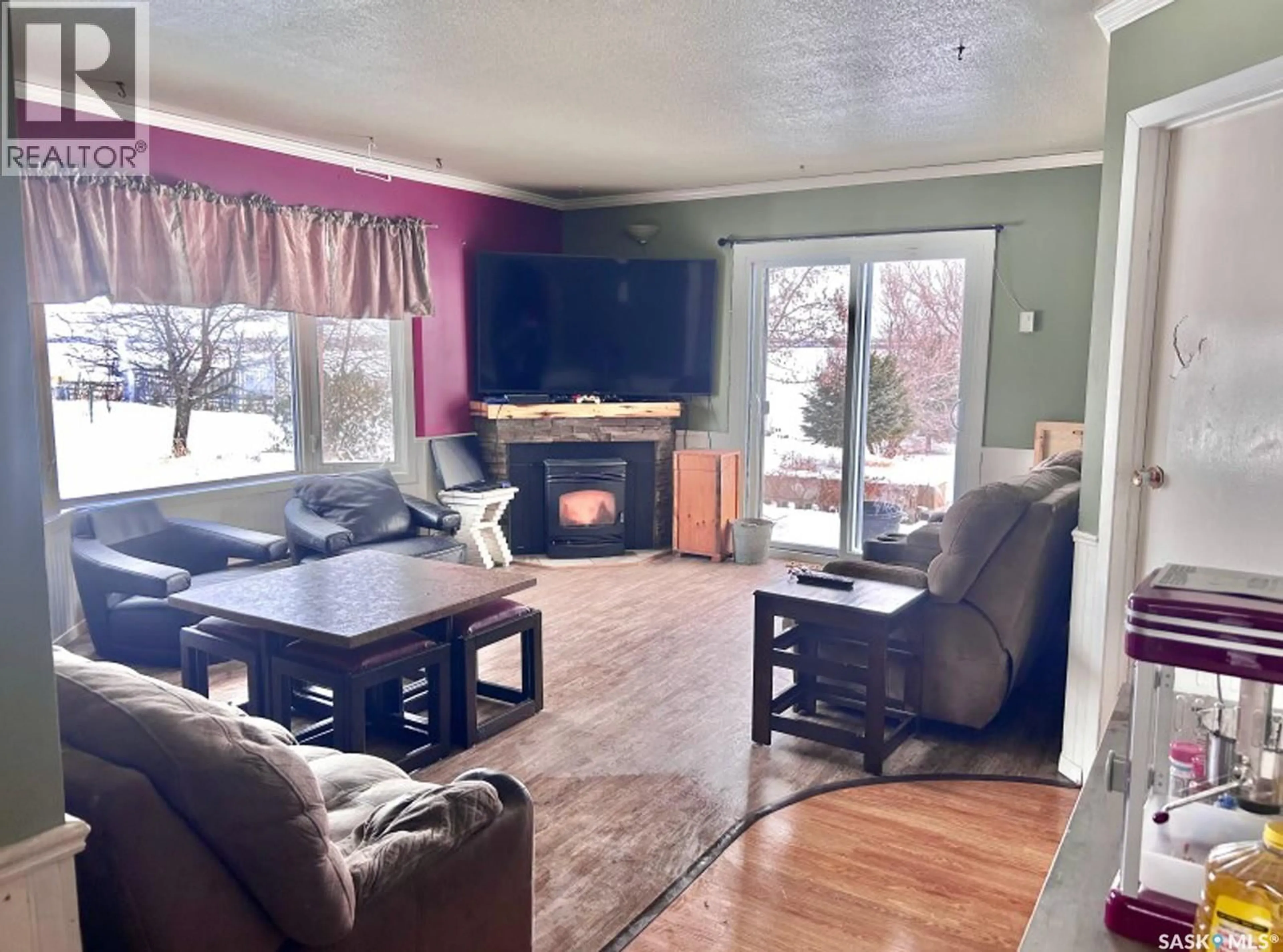 Living room with furniture, wood/laminate floor for 12 CAMPBELL ACREAGE, Meadow Lake Saskatchewan S9X1Y6
