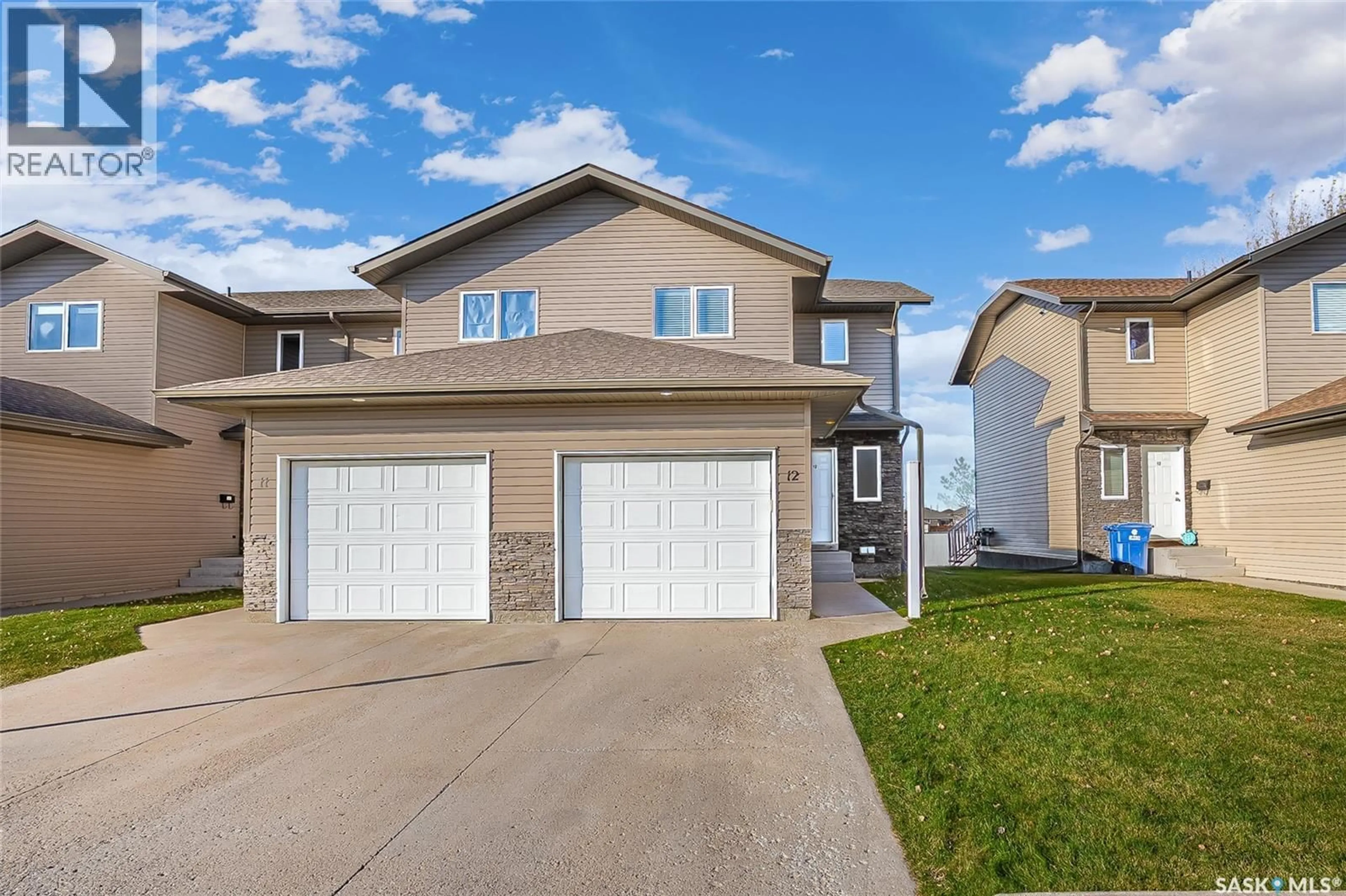 Home with vinyl exterior material, street for 12 515 CENTENNIAL BOULEVARD, Warman Saskatchewan S0K4S0