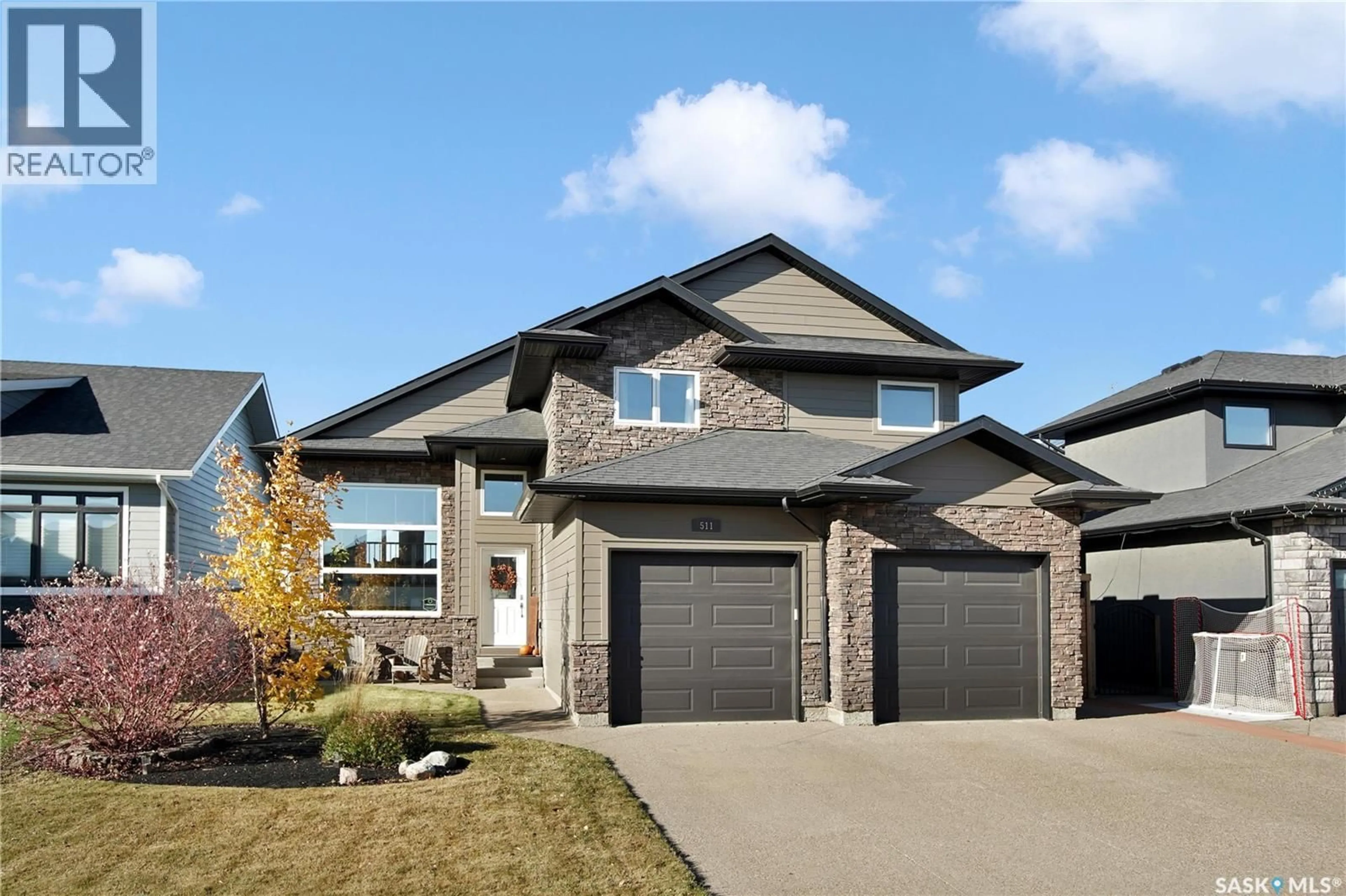 Home with brick exterior material, street for 511 COUPLES COURT, Warman Saskatchewan S0K4S1