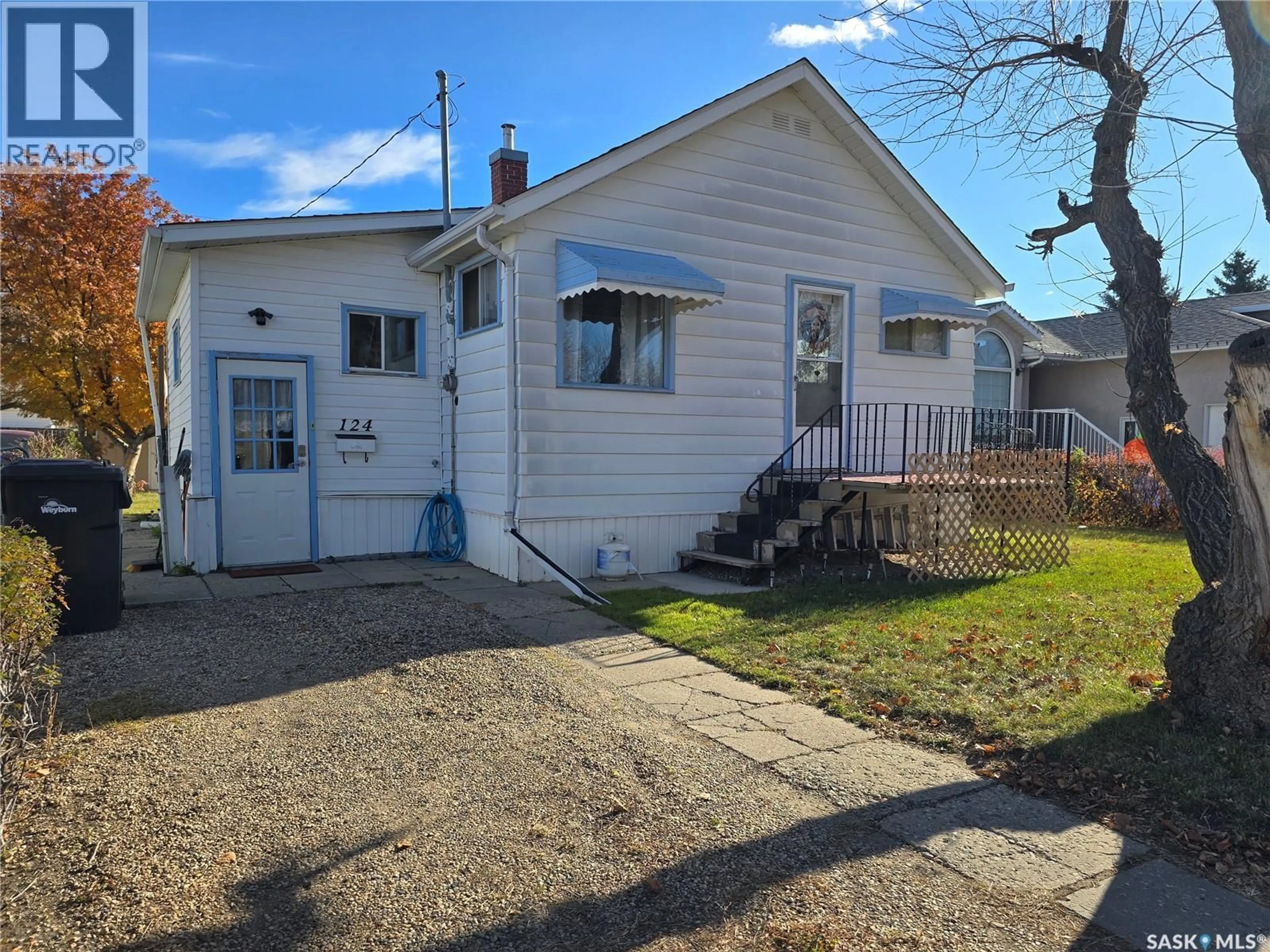 A pic from outside/outdoor area/front of a property/back of a property/a pic from drone, street for 124 10TH STREET, Weyburn Saskatchewan S4H1G9