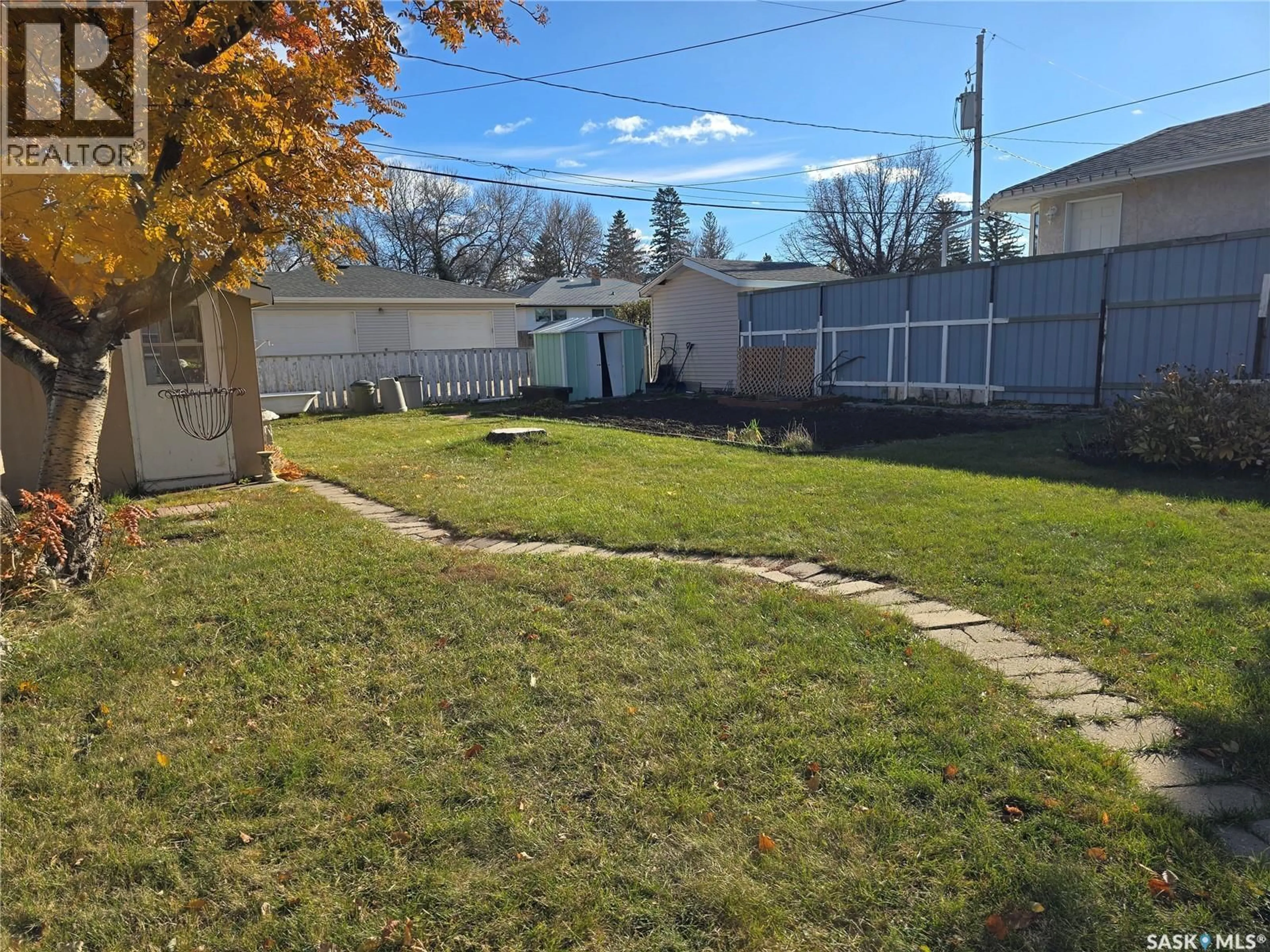 A pic from outside/outdoor area/front of a property/back of a property/a pic from drone, street for 124 10TH STREET, Weyburn Saskatchewan S4H1G9