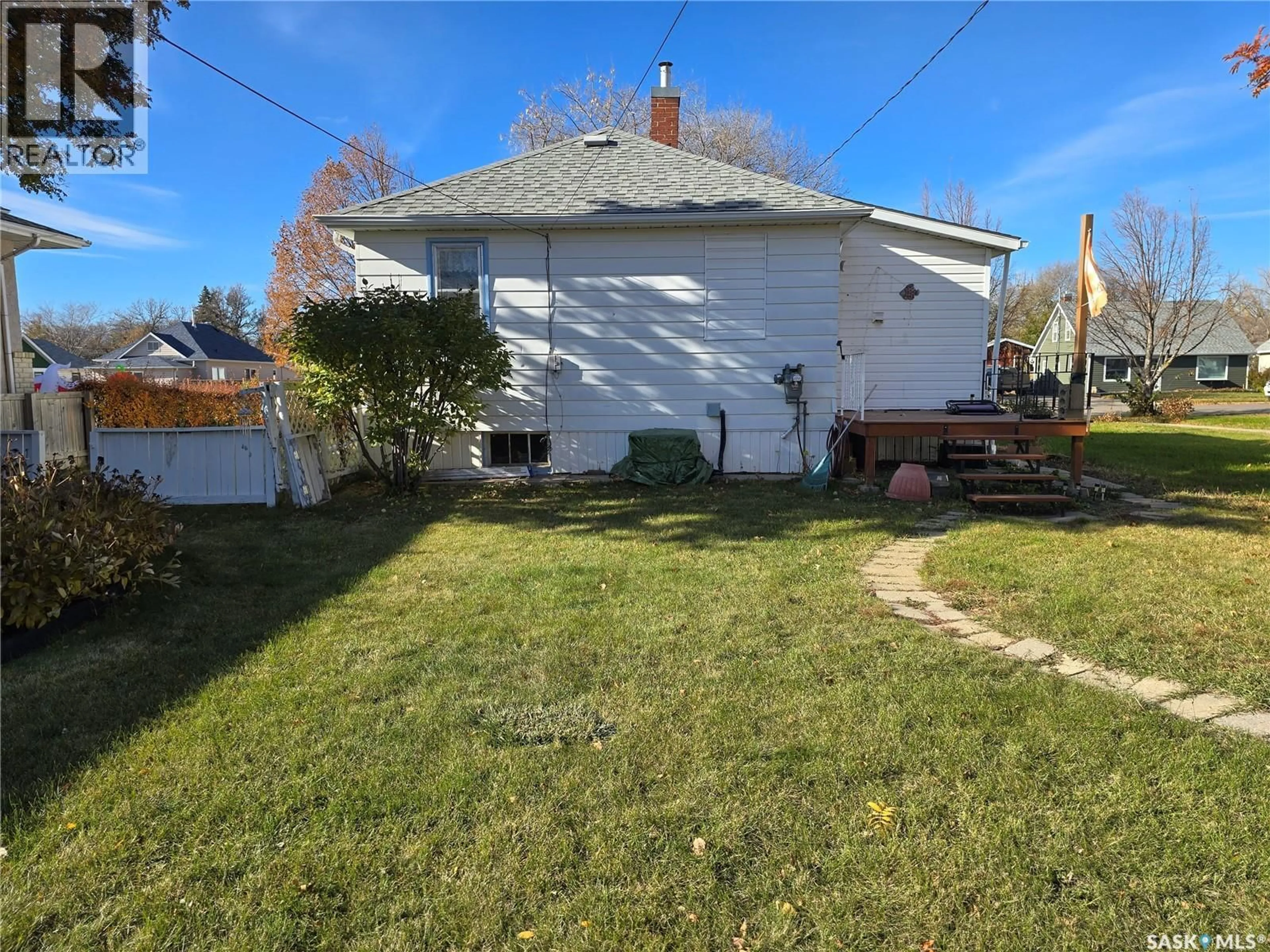 A pic from outside/outdoor area/front of a property/back of a property/a pic from drone, street for 124 10TH STREET, Weyburn Saskatchewan S4H1G9