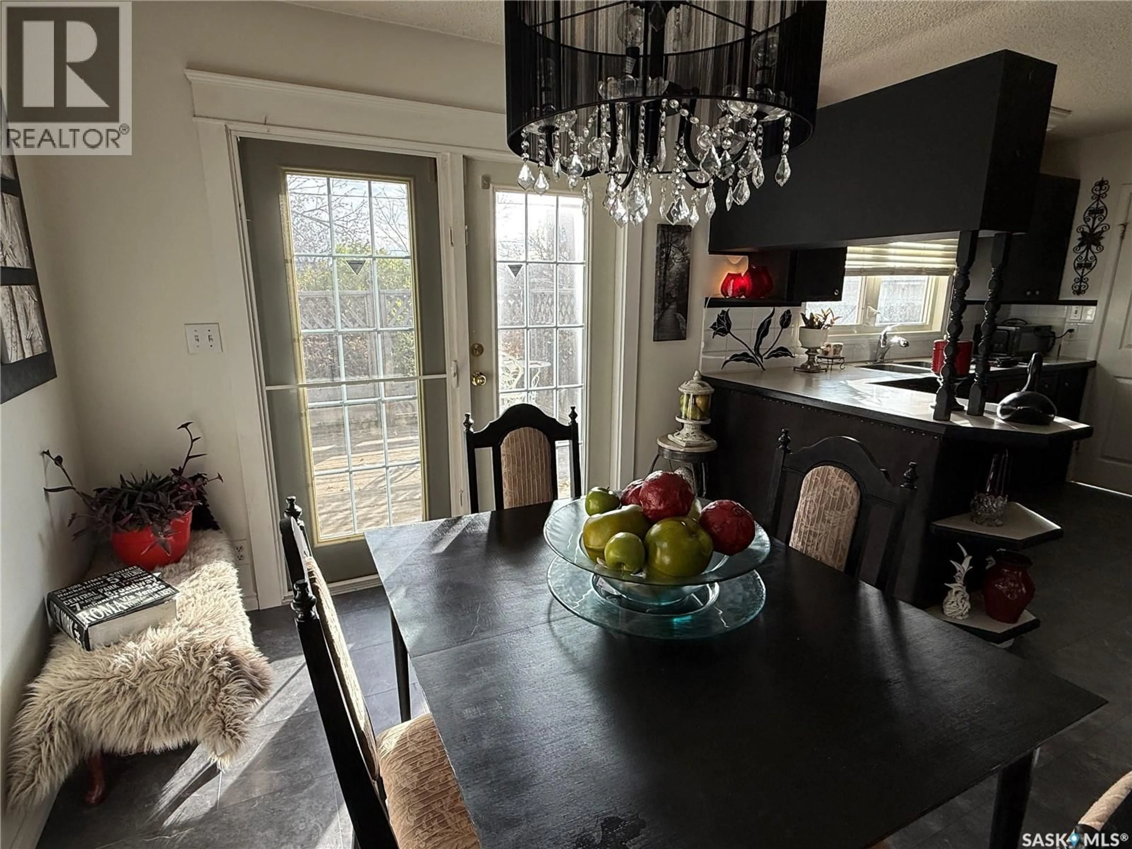 Dining room, wood/laminate floor for 216 ASH DRIVE, Weyburn Saskatchewan S4H0S2