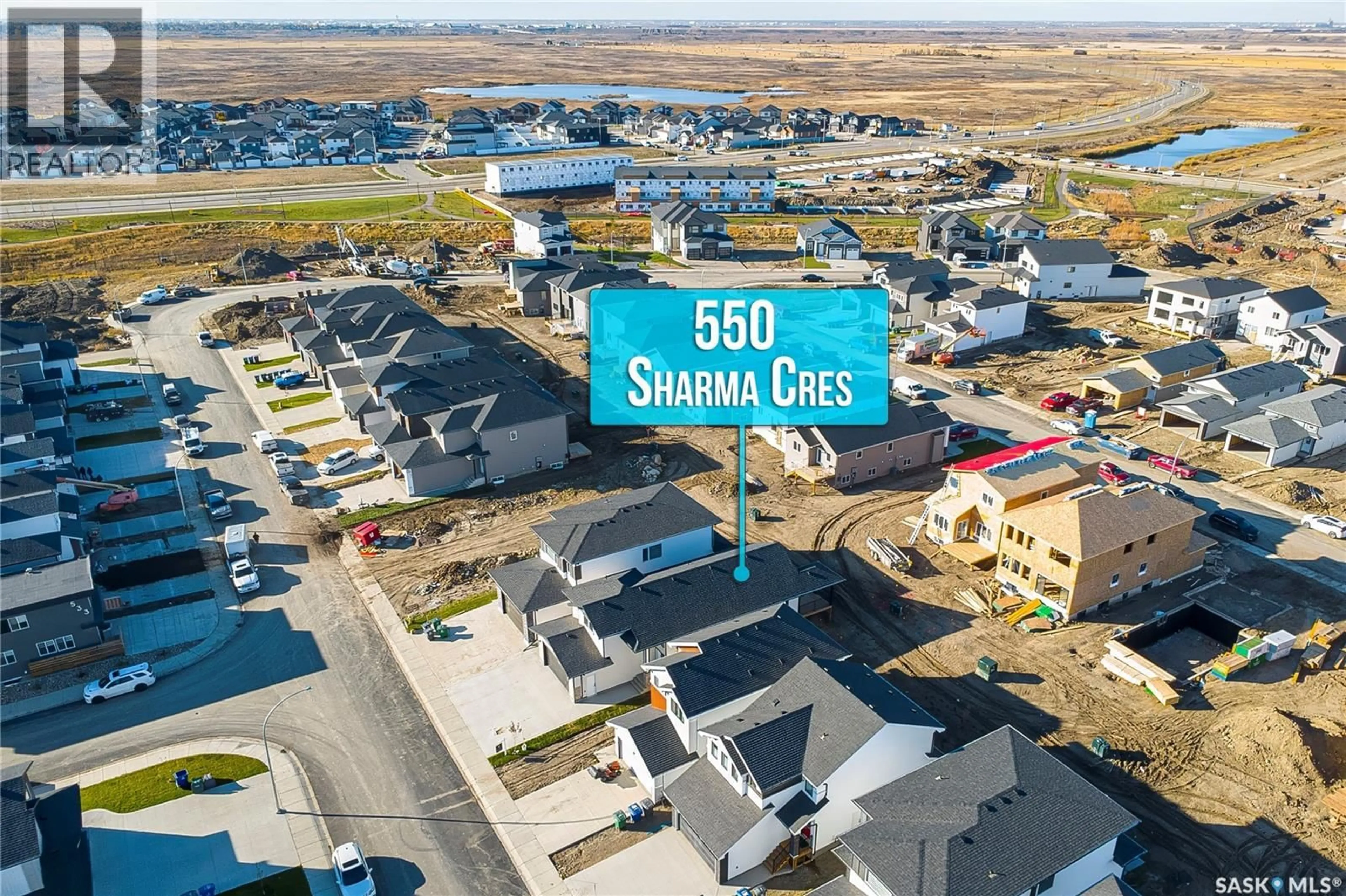 A pic from outside/outdoor area/front of a property/back of a property/a pic from drone, street for 550 SHARMA CRESCENT, Saskatoon Saskatchewan S7W1K9