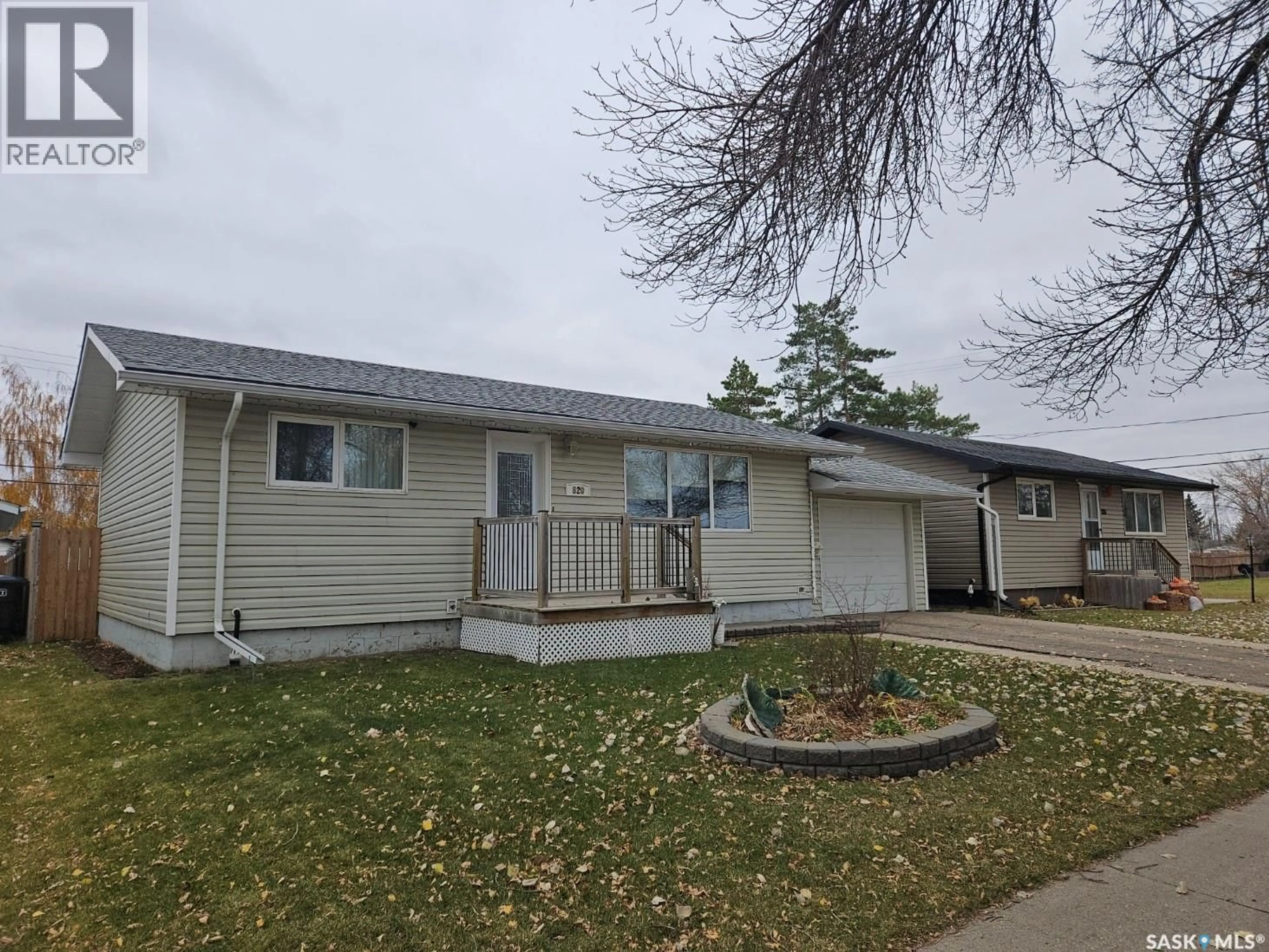 Home with vinyl exterior material, street for 820 14TH STREET, Humboldt Saskatchewan S0K2A0