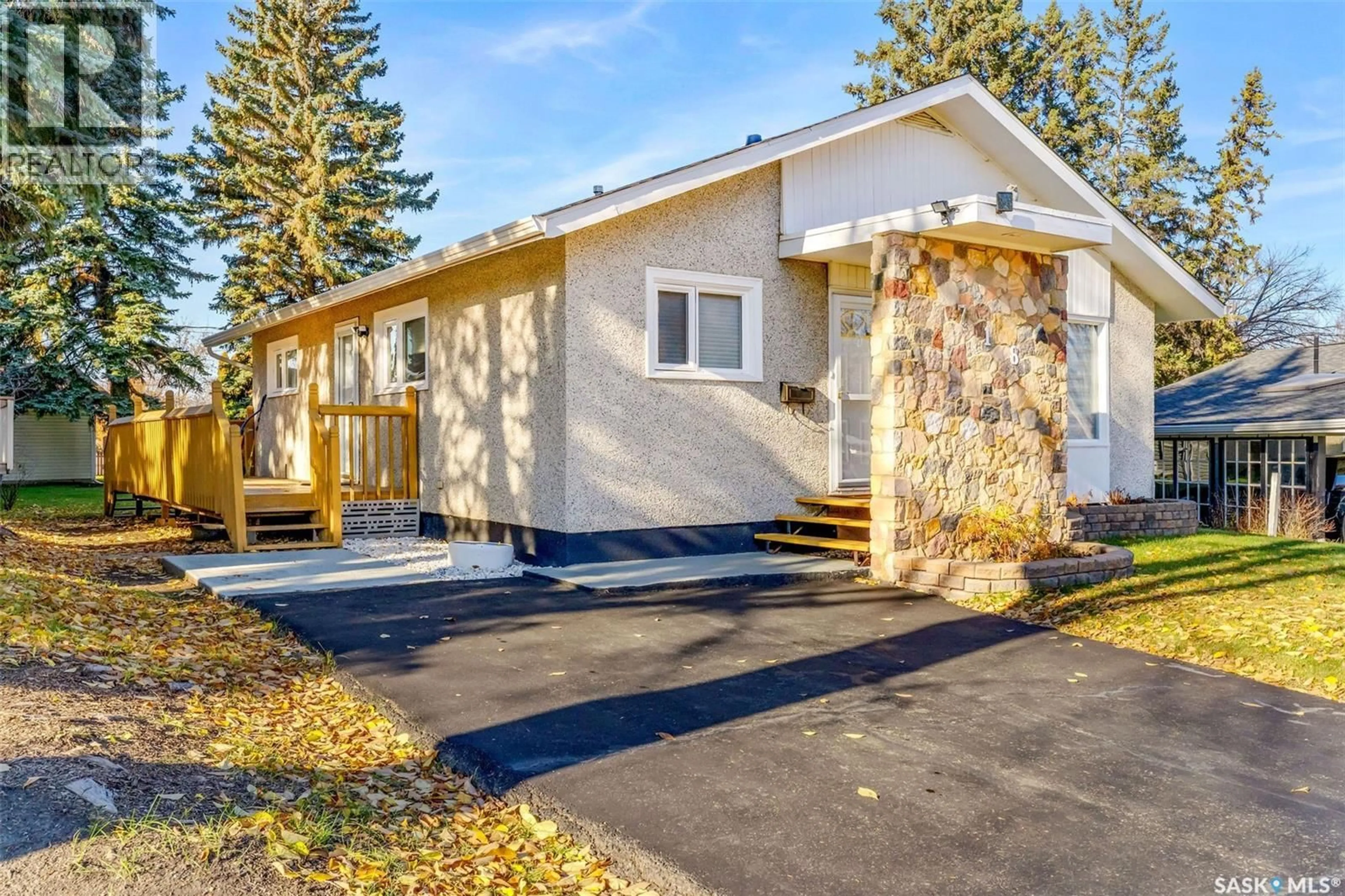 Home with vinyl exterior material, street for 718 CUELENAERE STREET, Prince Albert Saskatchewan S6V2S9