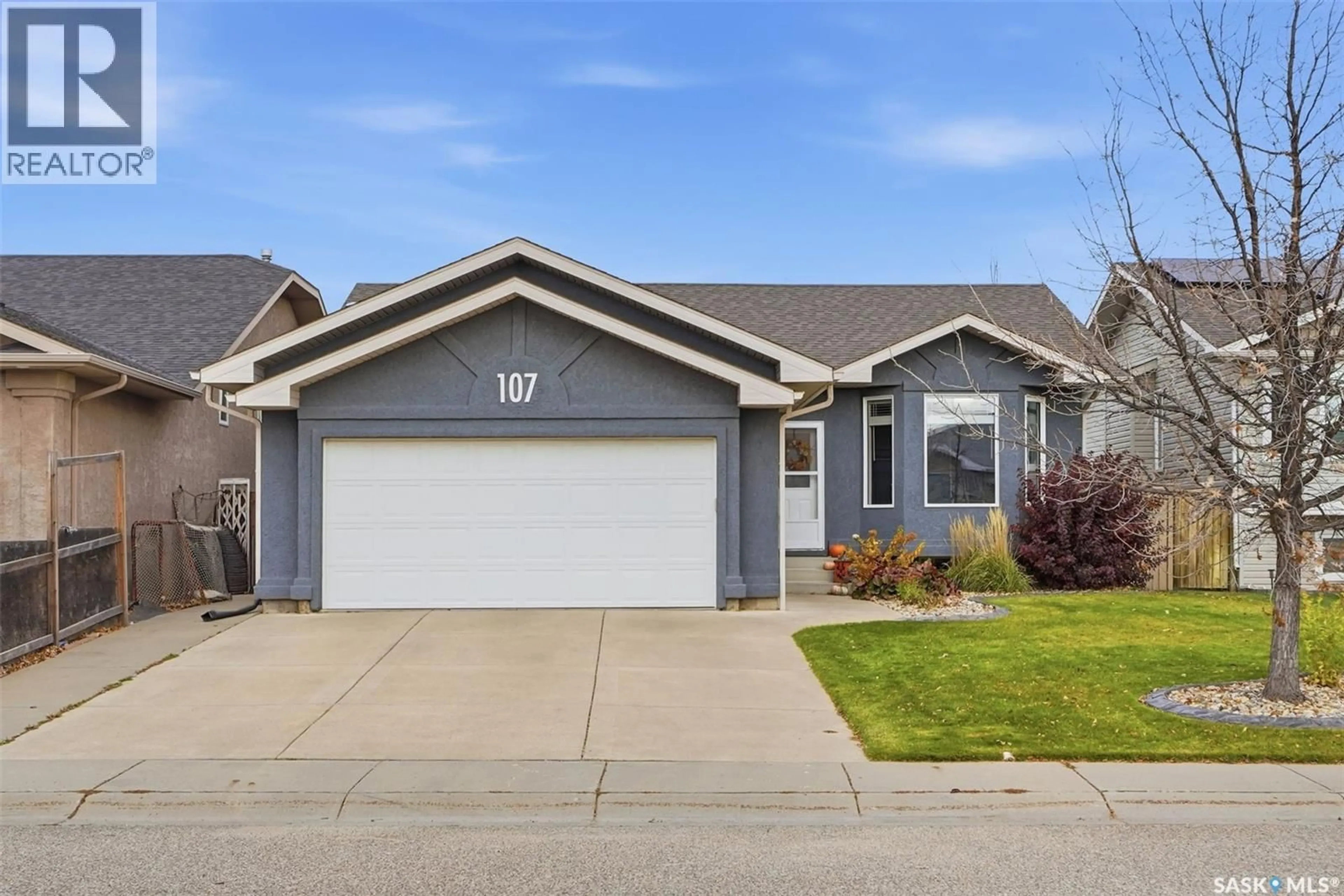 Home with vinyl exterior material, street for 107 CARR CRESCENT, Saskatoon Saskatchewan S7S1M3