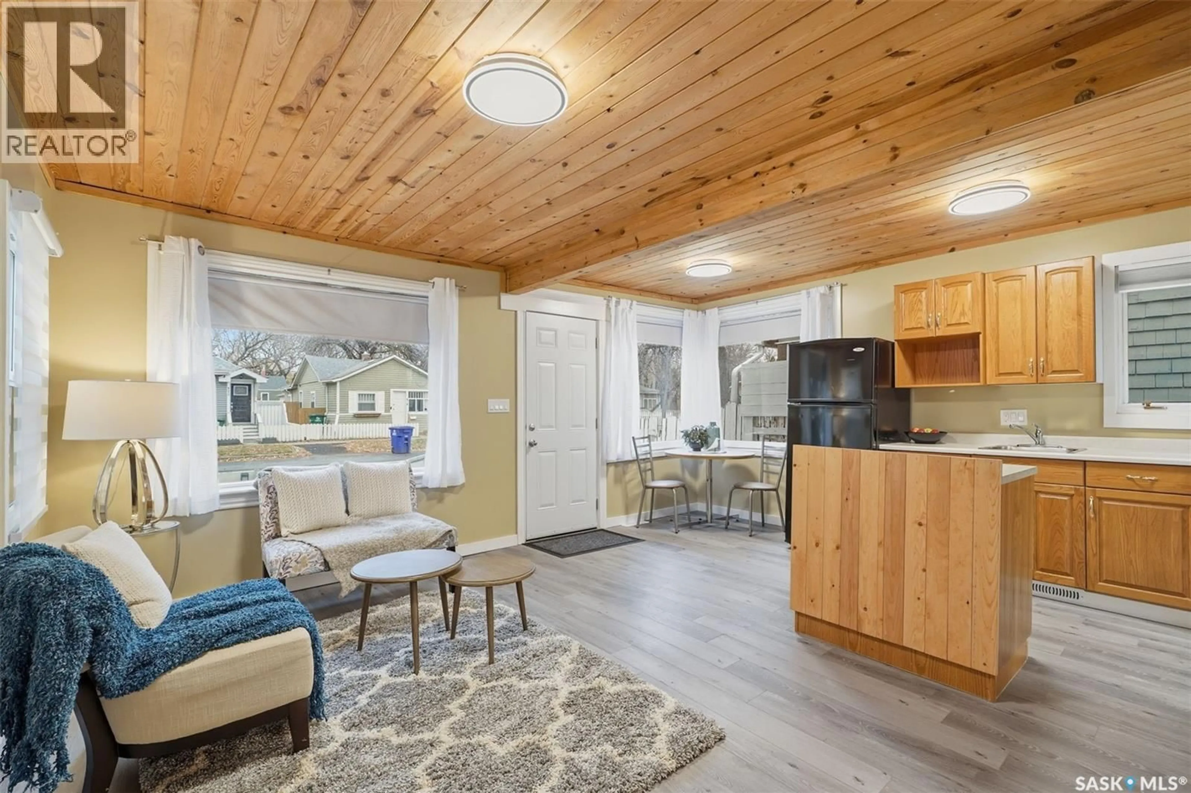 Open concept kitchen, wood/laminate floor for 821 G AVENUE, Saskatoon Saskatchewan S7L1Z6