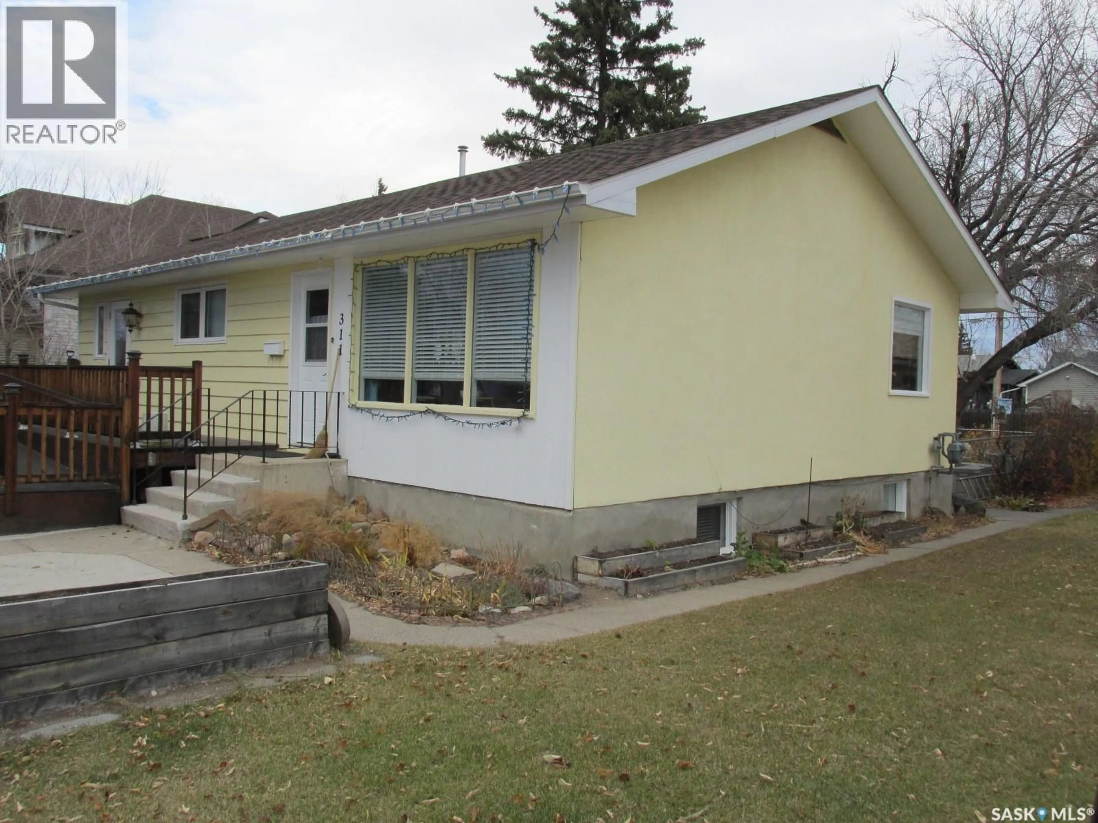 Home with vinyl exterior material, street for 311 1ST STREET, Nipawin Saskatchewan S0E1E0