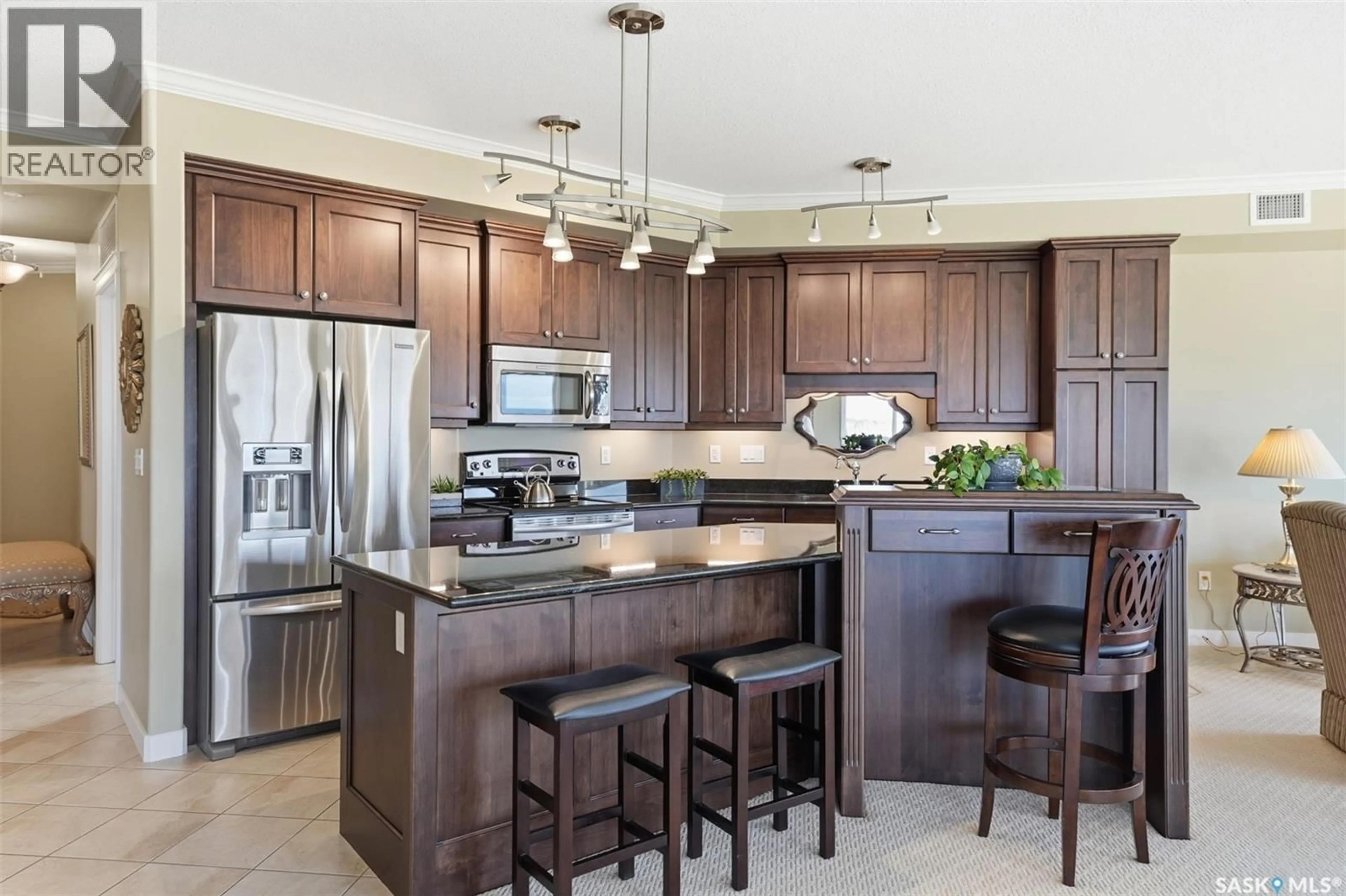 Open concept kitchen, ceramic/tile floor for 402 - 405 CARTWRIGHT STREET, Saskatoon Saskatchewan S7T0C8